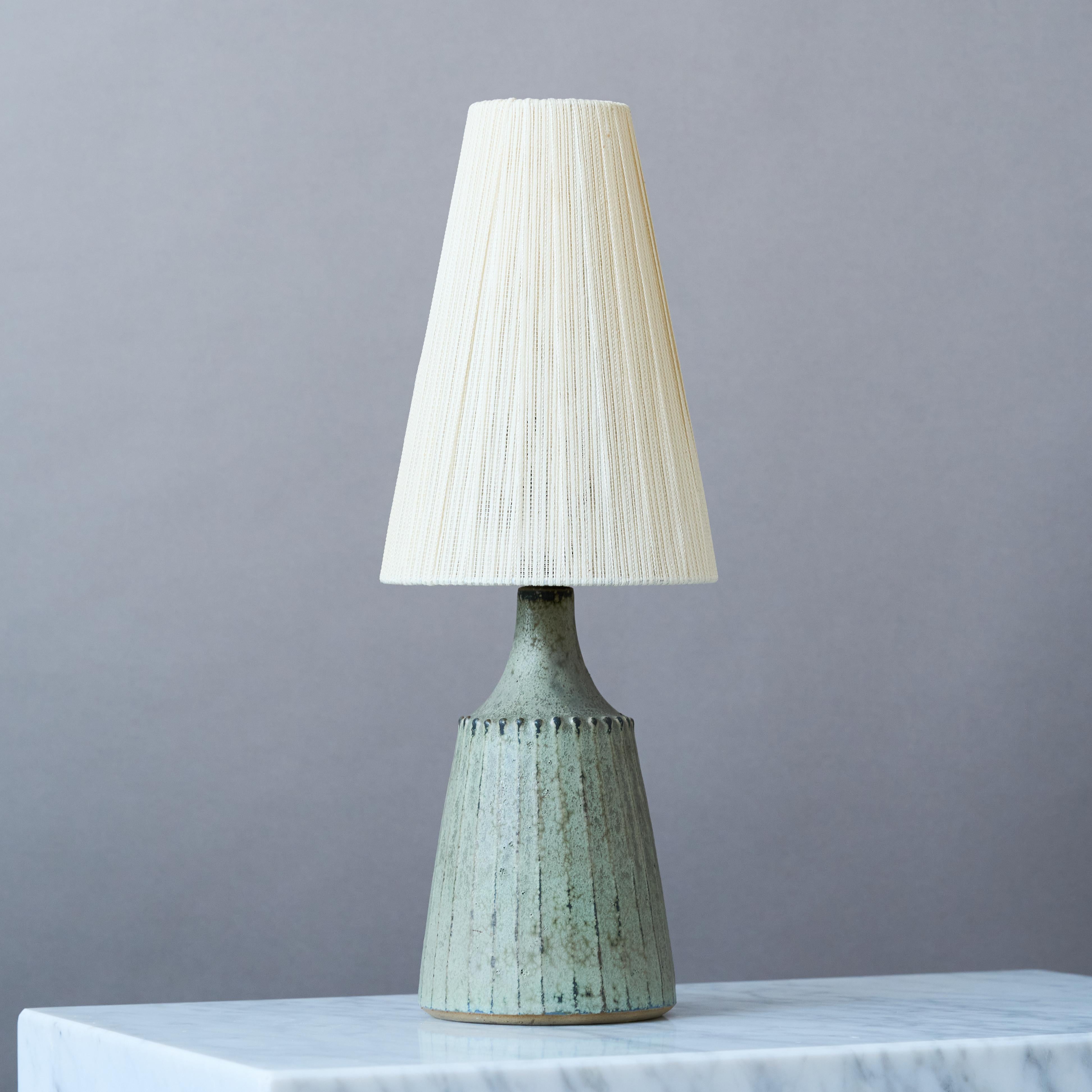 A beautiful mid-century stoneware table lamp with amazing glaze.
Made by Rolf Palm, in the artist's studio, Mölle, Sweden, 1960s.

Great original condition. 
Signed 'Palm'.

Sold without lampshade.

Dimensions of the lamp (without the shade):
Height