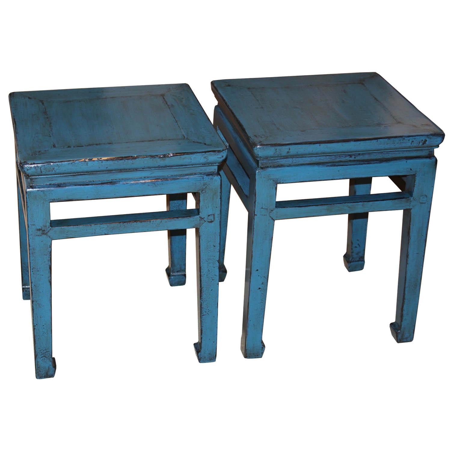 Blue lacquered elmwood Ming-style table with exposed wood edges, support bars and horse hoof-style feet can be used as a pair of coffee tables in front of a sofa or as extra seating. Priced individually not as a pair.
