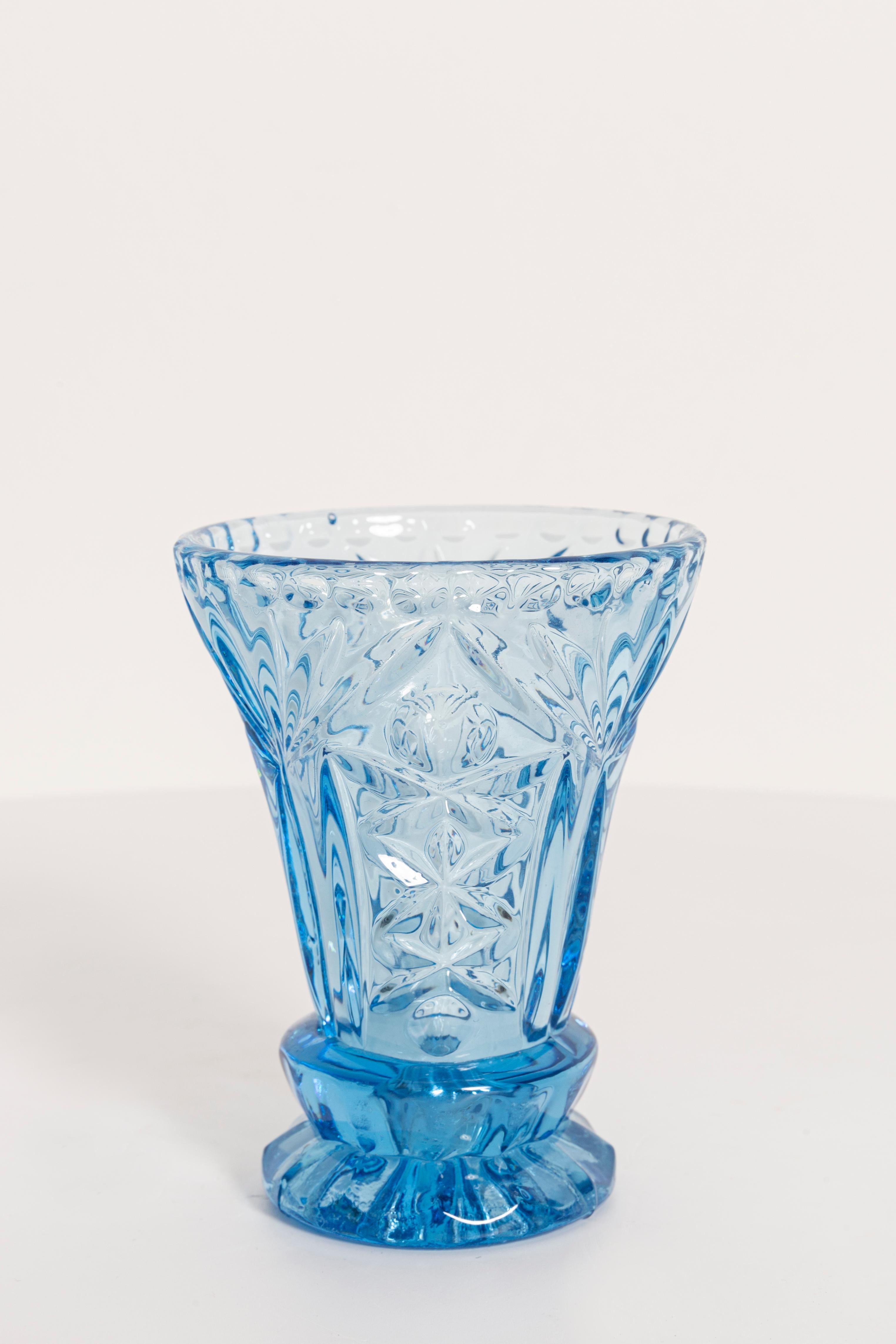 Produced in 1960s.

Pressed glass in perfect condition.
The vase looks like it has just been taken out of the box.
The picture reflects the color in which it presents live.

No jags, defects etc. 
The irregular surface of the object reflects