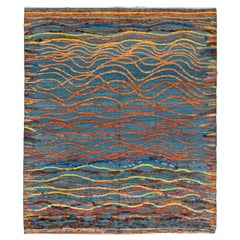 Blauer moderner Wollteppich im marokkanischen Stil mit mehrfarbigem, abstraktem Design