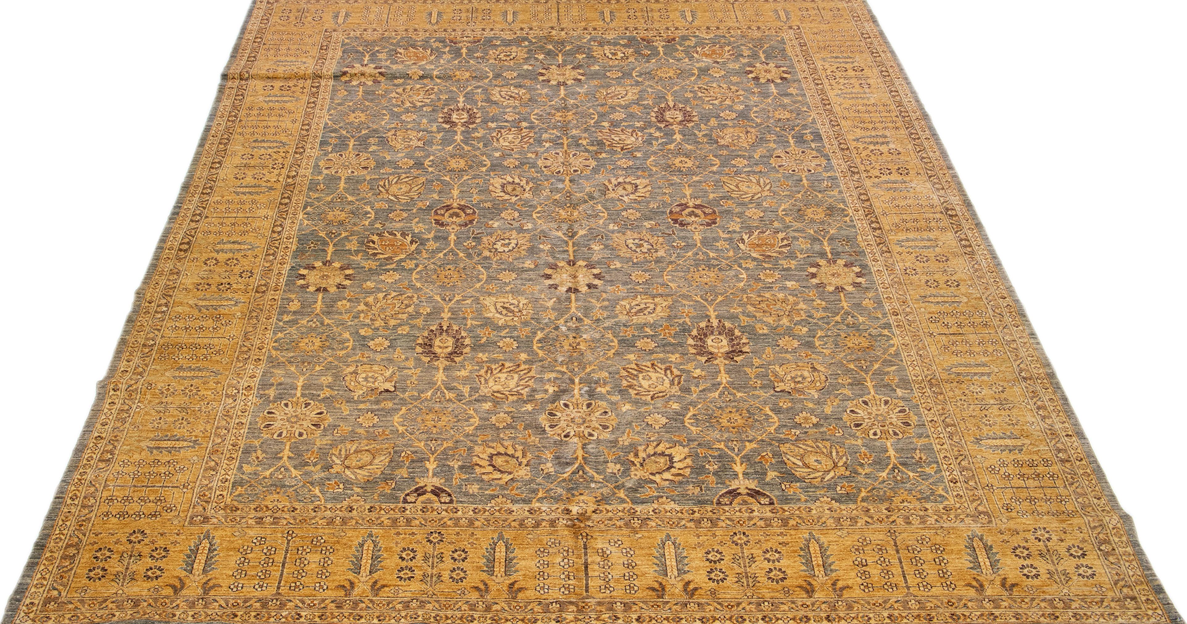 Beautiful Paki Peshawar hand-knotted wool rug with a gray color field. This modern rug has a goldenrod frame with gray and brown accents, a beautiful all-over Classic vine scroll, and a palmettes motif.

This rug measures: 10' x 13'7