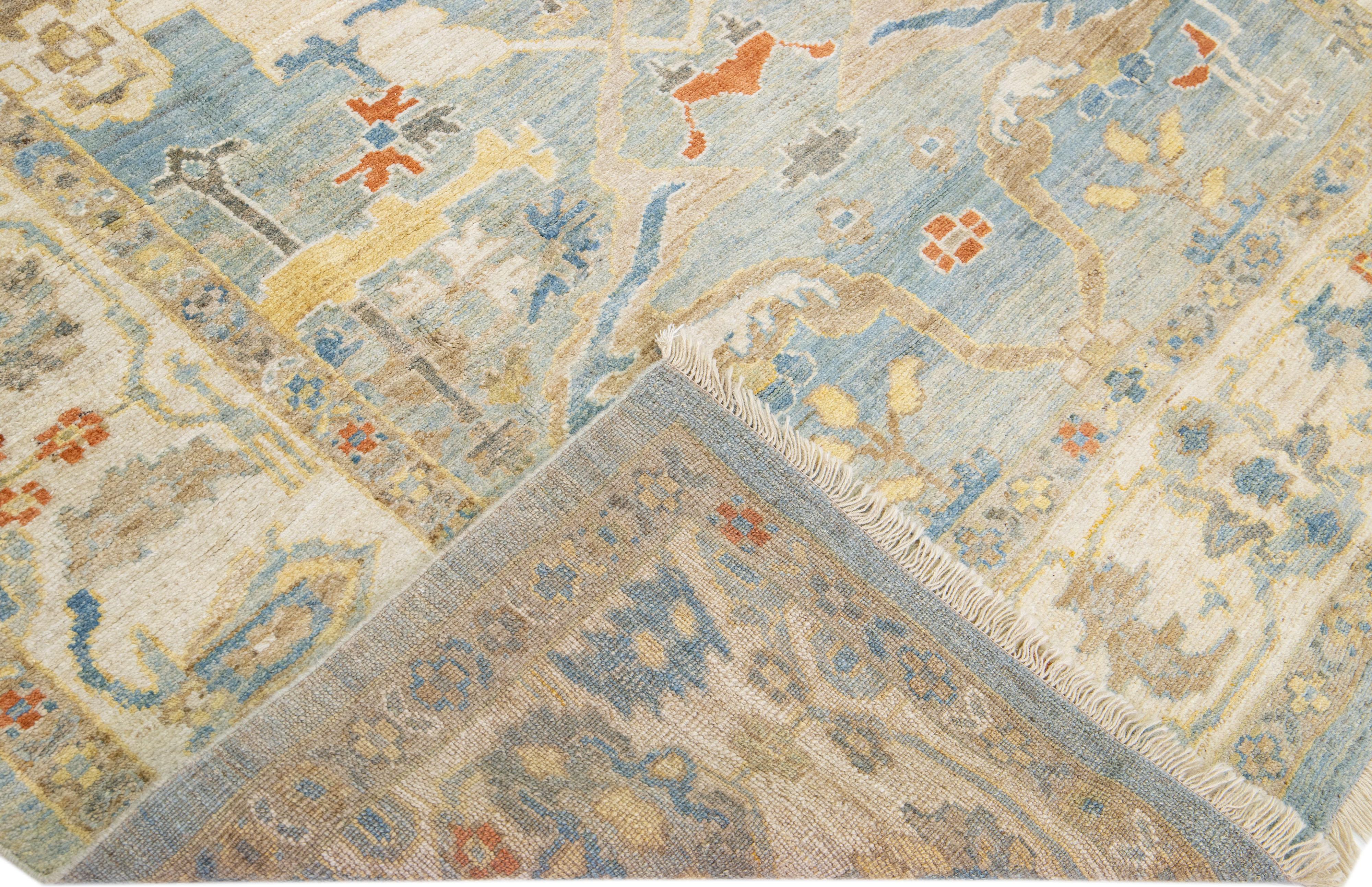 Beautiful modern Sultanabad hand-knotted wool rug with a blue field. This rug has a beige frame and multicolor accents in a gorgeous all-over floral design.

This rug measures: 6'9