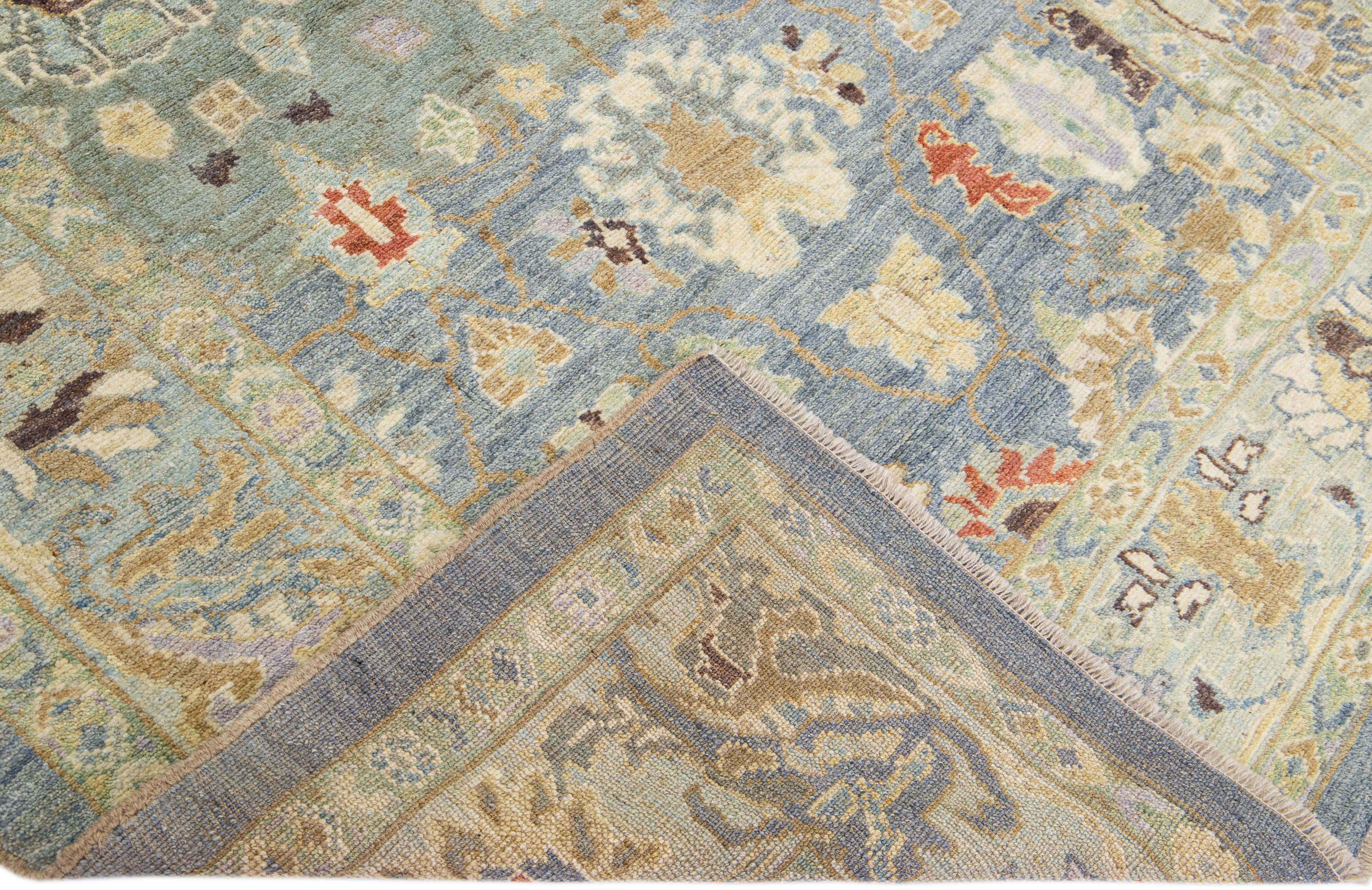 Beautiful modern Sultanabad hand-knotted wool rug with a blue field. This Sultanabad rug has a green frame and multicolor accents in a gorgeous all-over classic floral pattern design.

This rug measures: 5'9