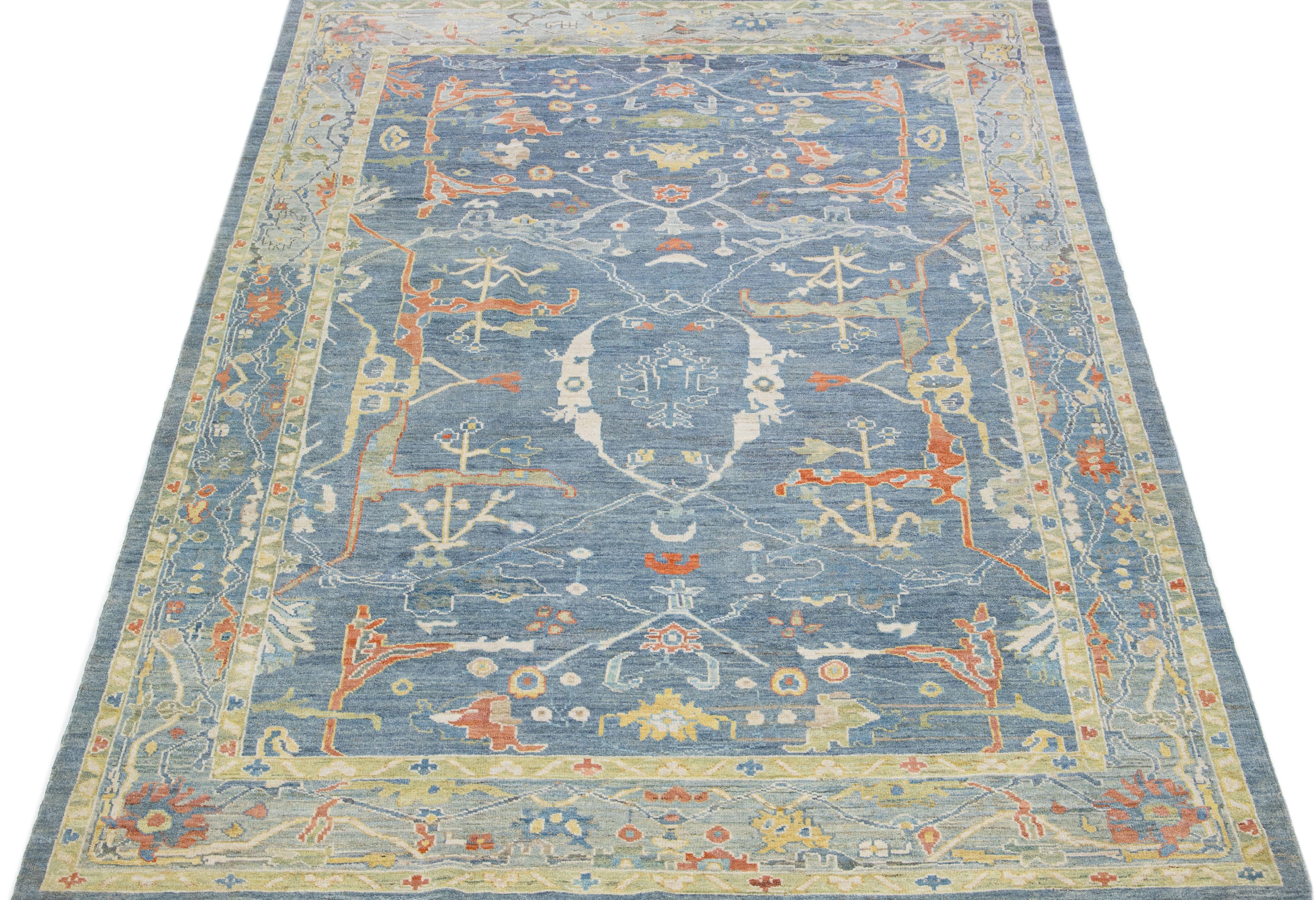 Beautiful modern Sultanabad hand knotted wool rug with a blue color field. This rug has a beige-designed frame with multicolor accents in a gorgeous all-over floral design.

This rug measures: 8'2