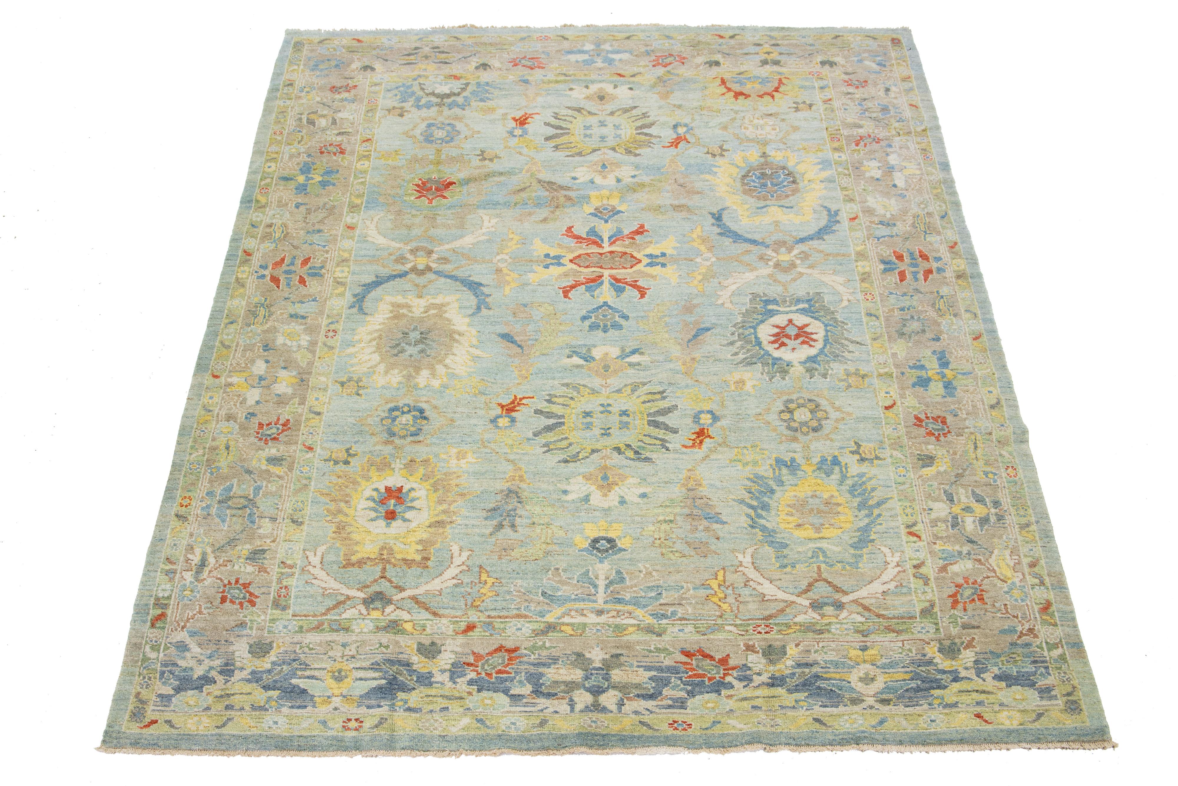 Beautiful modern Sultanabad hand-knotted wool rug with a blue field. This Sultanabad rug has a brown frame and multicolor accents in a gorgeous all-over classic floral pattern design.

This rug measures 8'9
