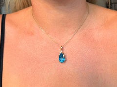 Blue Modified Pear Topaz and Diamond Necklace 18K Yellow Gold