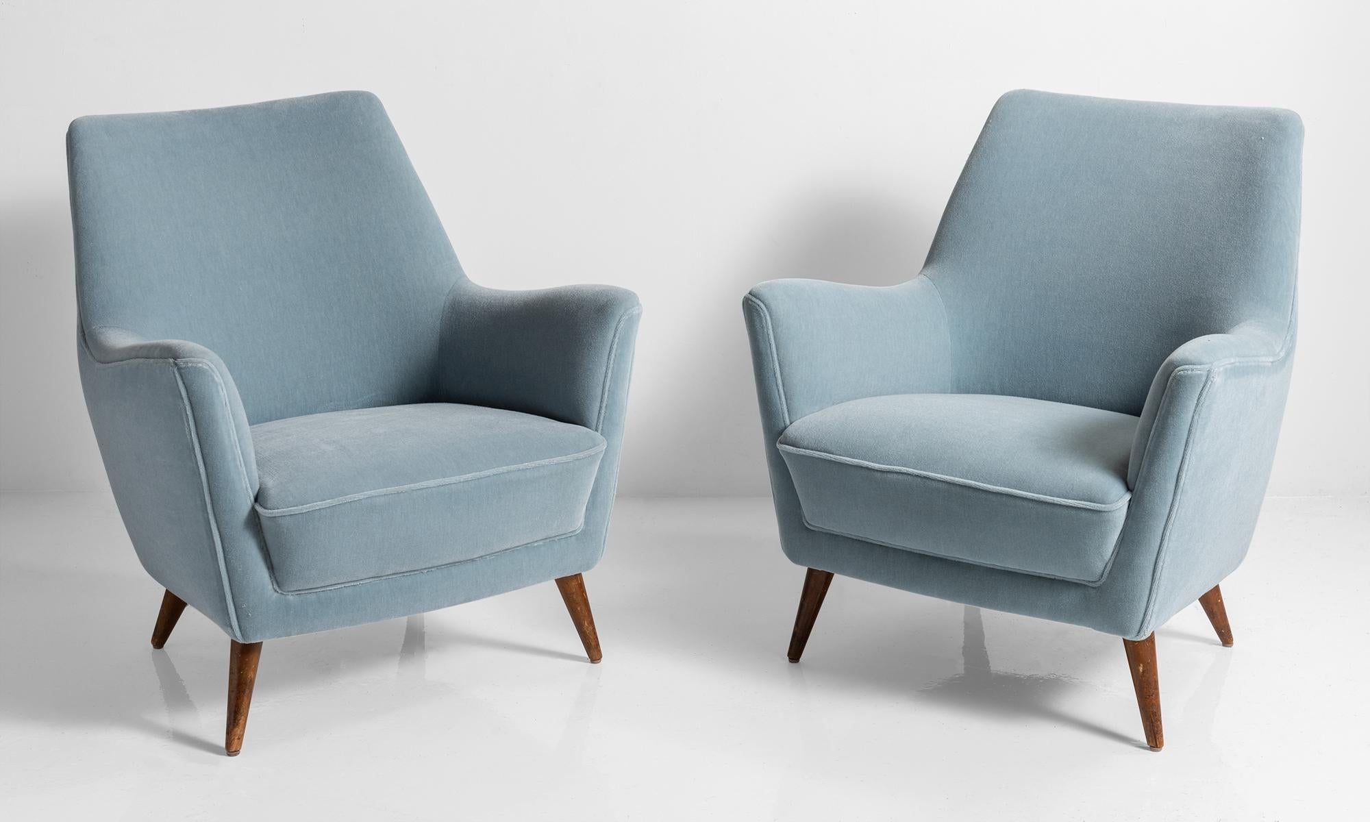 Blue mohair armchairs, Italy, circa 1960.

Newly upholstered in blue mohair, on original legs.