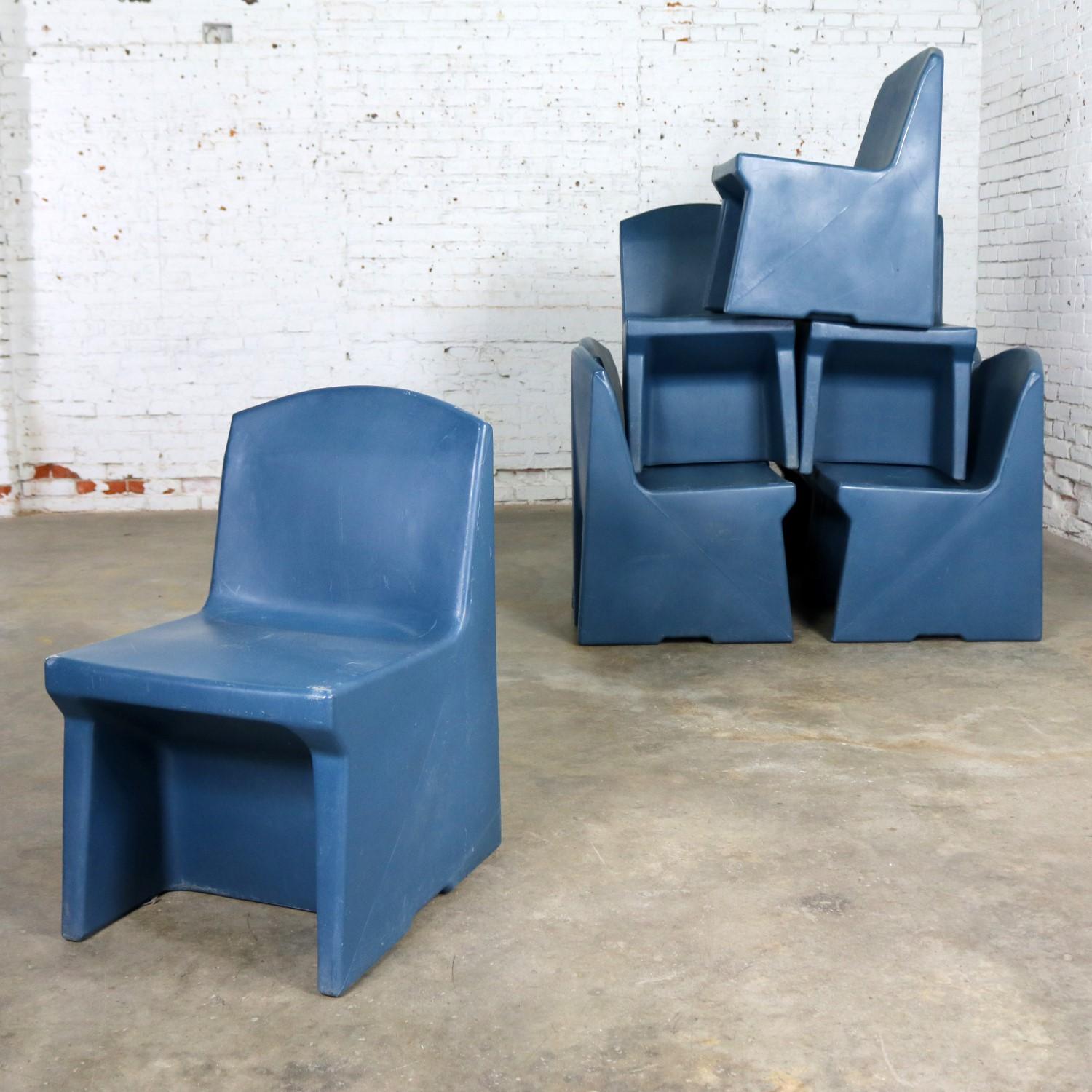 Fun and useful set of eight blue molded polyethylene plastic side or slipper chairs by Norix from the Toughcare Series. In great condition and ready to use. They do have the patina of age and use with small nicks and scratches as you would expect.