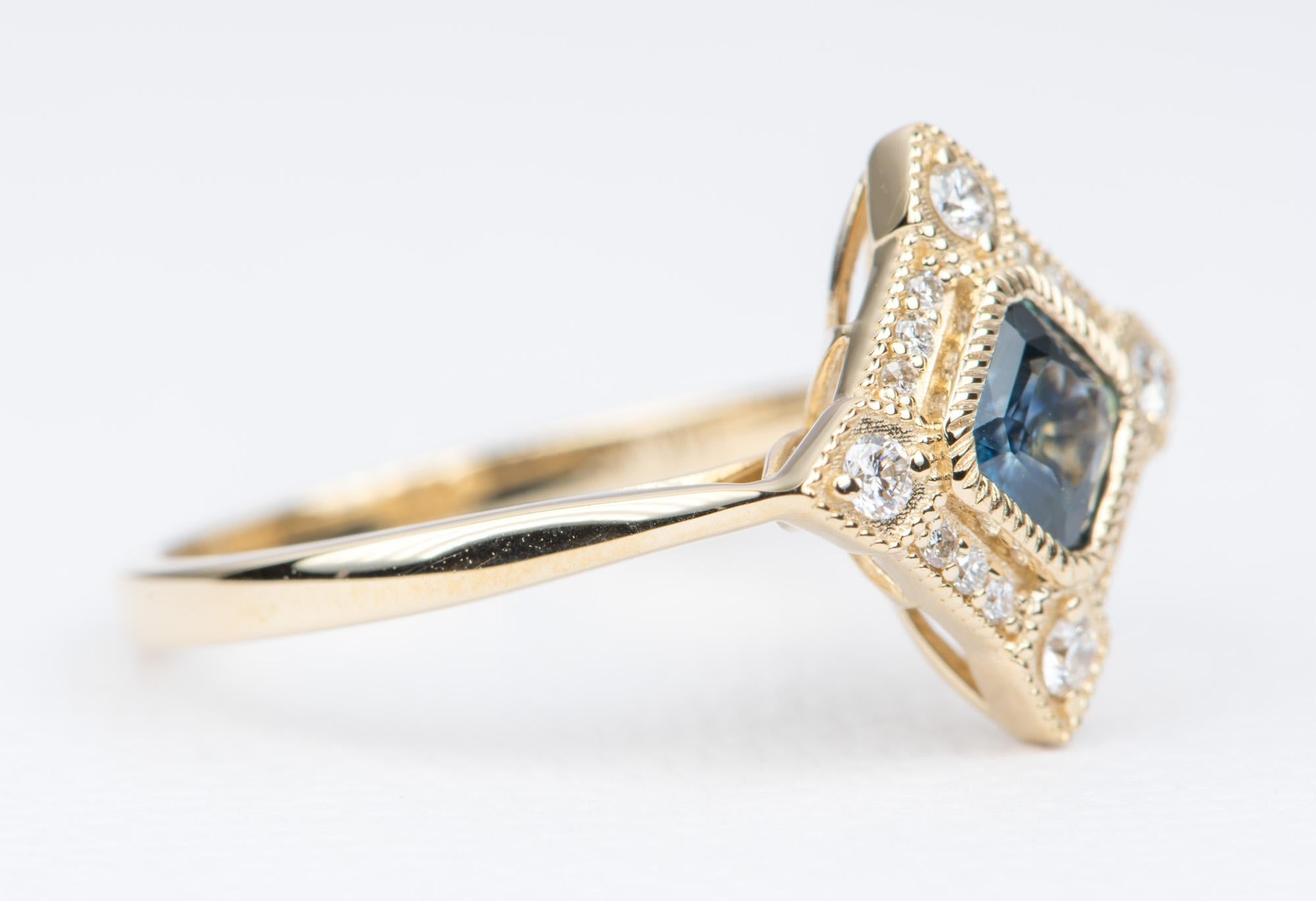 ♥  A solid 14K gold ring set with a beautiful Montana Sapphire in the center and encircled by a halo of colorless diamonds in a unique design
♥  The center stone is bezel set with milgrain details. The halo also has an outer milgrain edge, for an