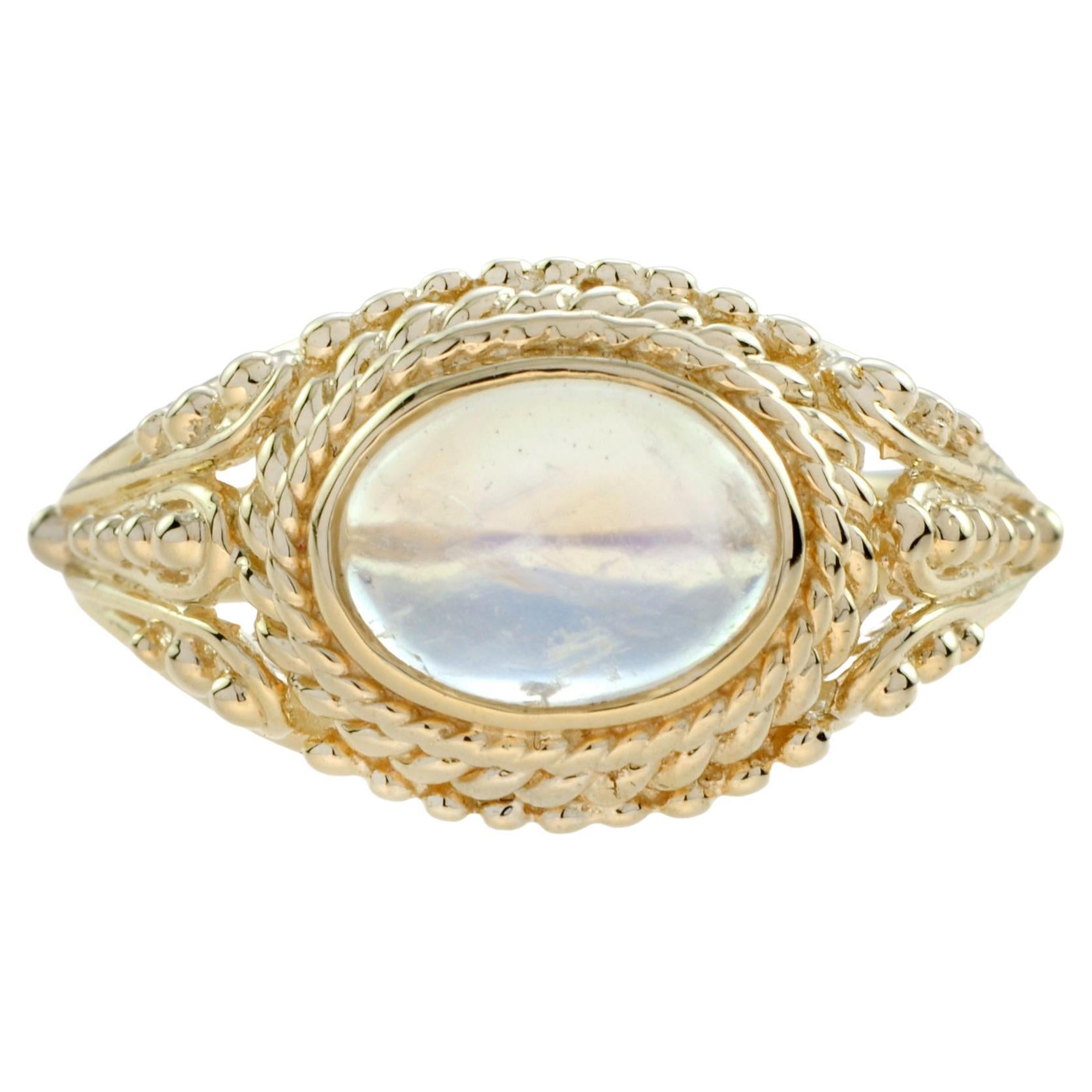 A confident addition to your digits, the blue moonstone centerpiece and luscious yellow gold base make every glance of this ring one to remember. A braided gold rope accent lends another dimension of color to accentuate the gem. 

Ring