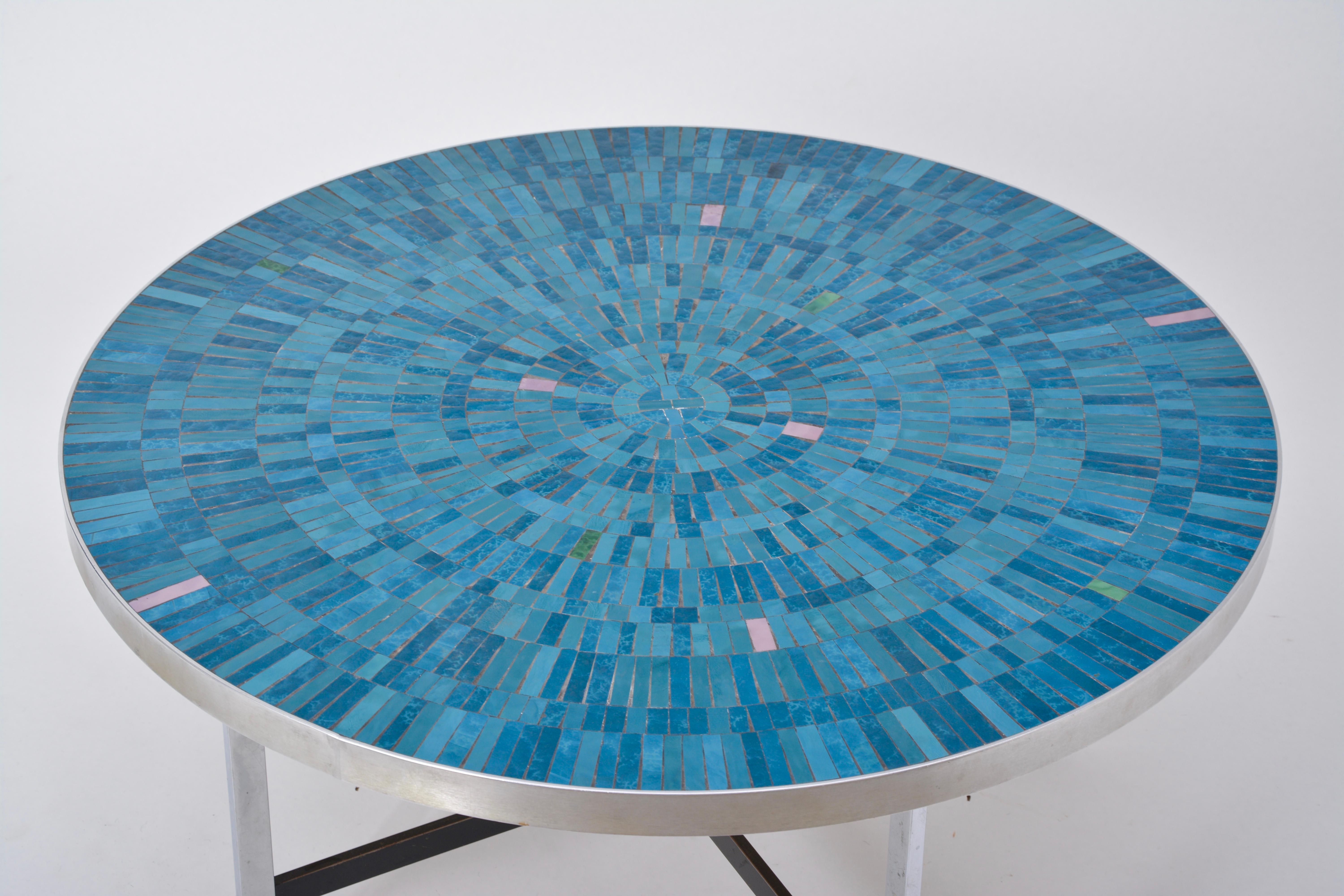 Blue German Mid-Century Modern Mosaic coffee table Berthold Mueller-Oerlinghaus

Big circular vintage coffee table with mosaic tabletop in various tones of blue designed by Berthold Müller-Oerlinghaus and produced by Mosaikwerkstatt Berthold