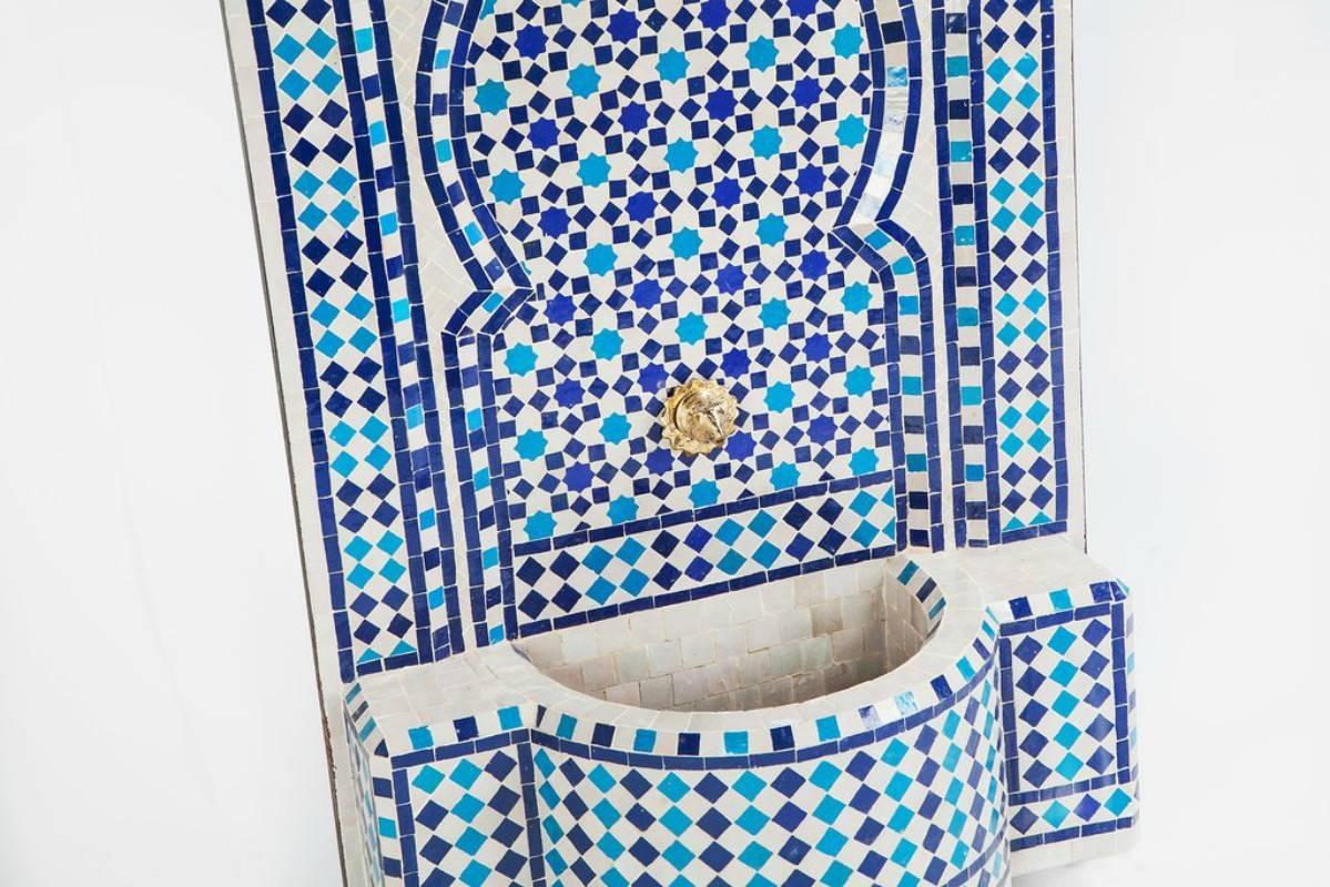 Blue Mosaic Mediterranean water fountain this stylish and soothing Mediterranean fountain features two-toned blue and white mosaic tiles and a wonderfully unique hand-carved brass spout. For your added convenience, this fountain comes ready to use