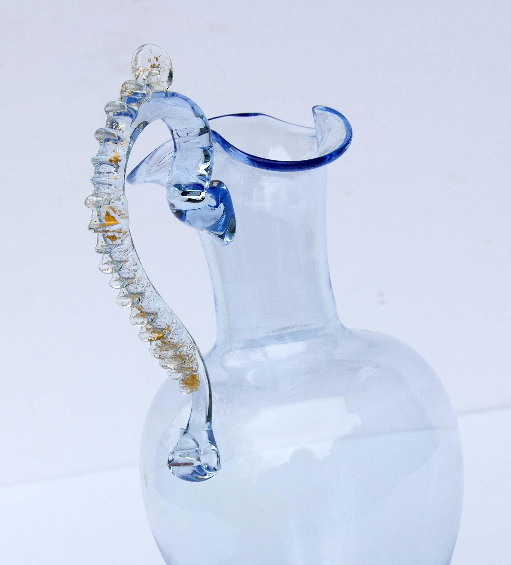 Murano blown glass ewer with applied handle with gold flakes. Light blue. Attributed to Salviati.