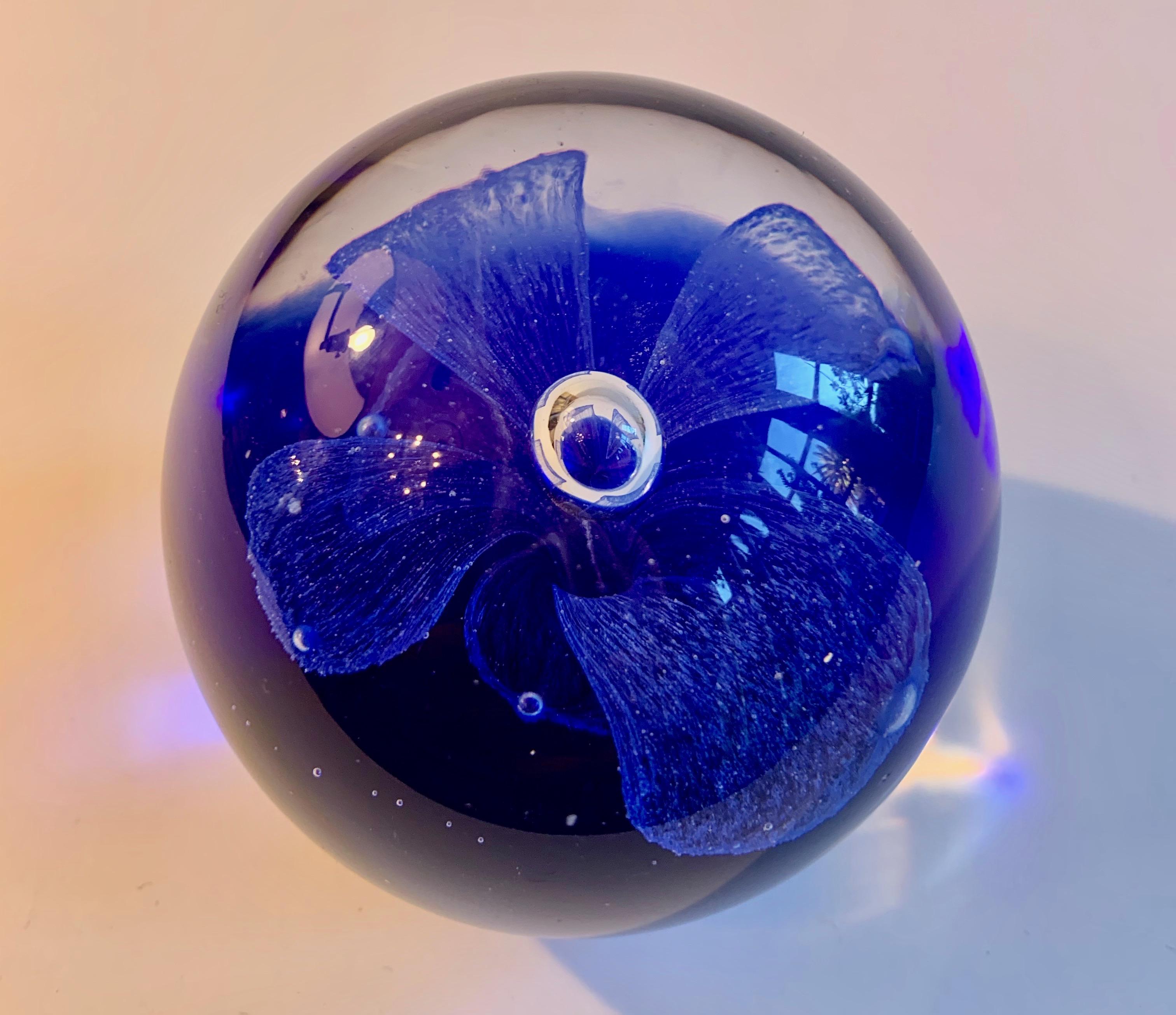 Blue Murano flower paperweight - a lovely sphere with a blue blown flower on a blue field. A wonderful decorative piece. At 2.5