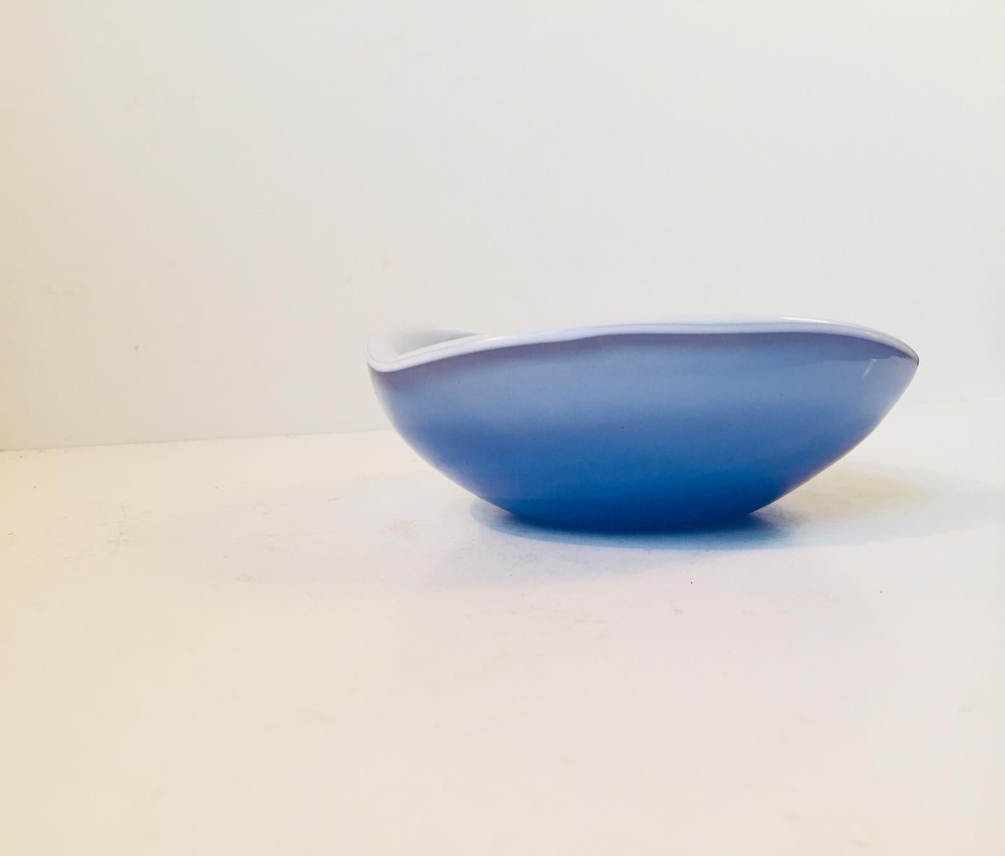 - Decorative bowl or ashtray
- Composed of a cased baby blue glass exterior and an interior in opaline glass
- Made by Cenedese Vetri
- Produced in Murano, Italy during the late 1950s - early 1960s.
