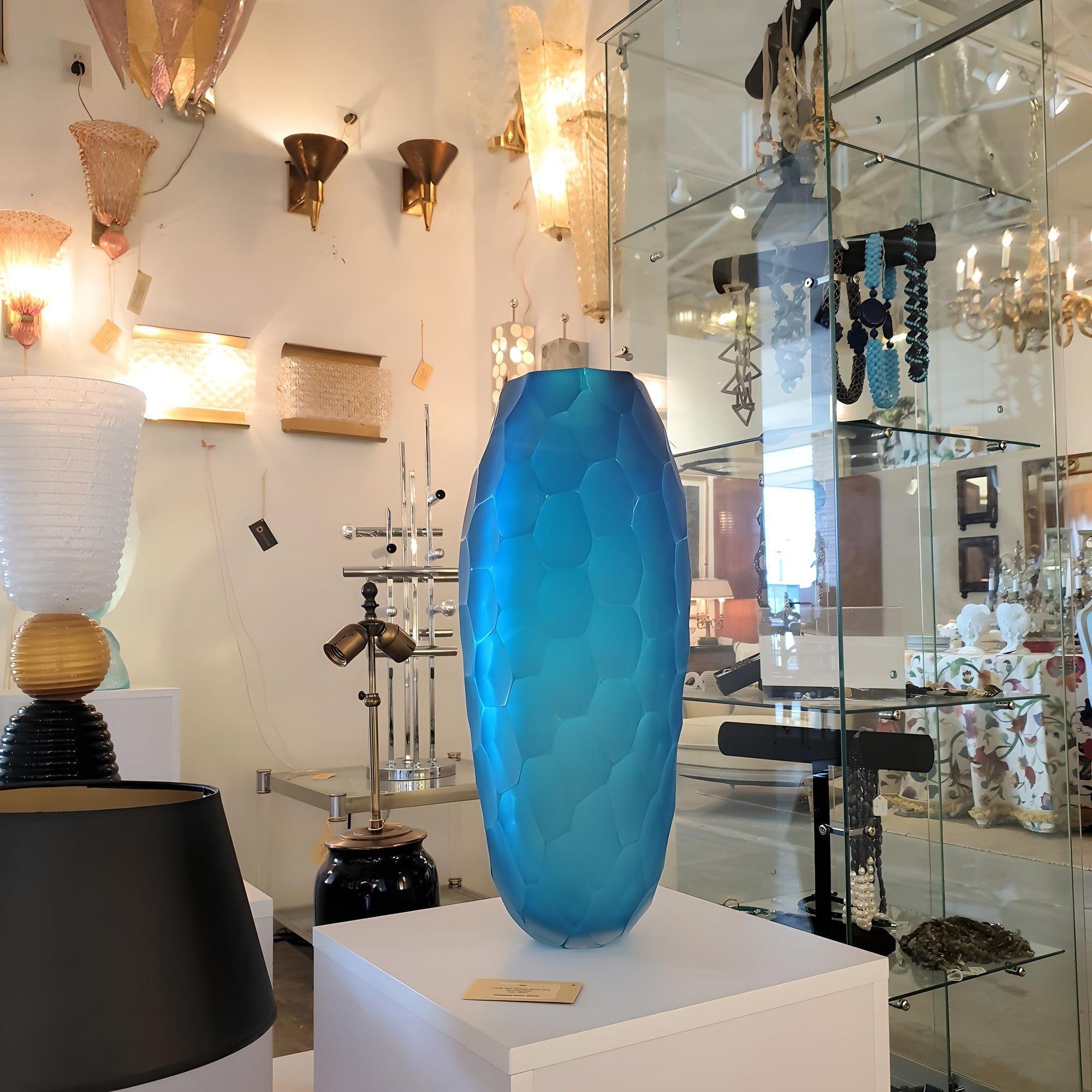 Very large blue translucent Mid Century Modern Murano glass vase.
Attributed to Simone Cenedese, Murano, Italy, 1980s.
The blue Murano glass is thick and heavy.
The Murano glass is faceted outside, creating a mat effect.
A beautiful piece of Murano