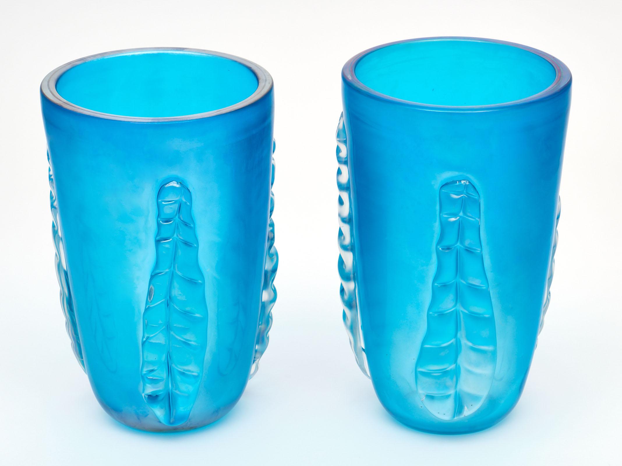 A pair of important blue Murano glass “Veronese” vases signed by Costantino. We love the deep aquamarine color of these hand blown vases.