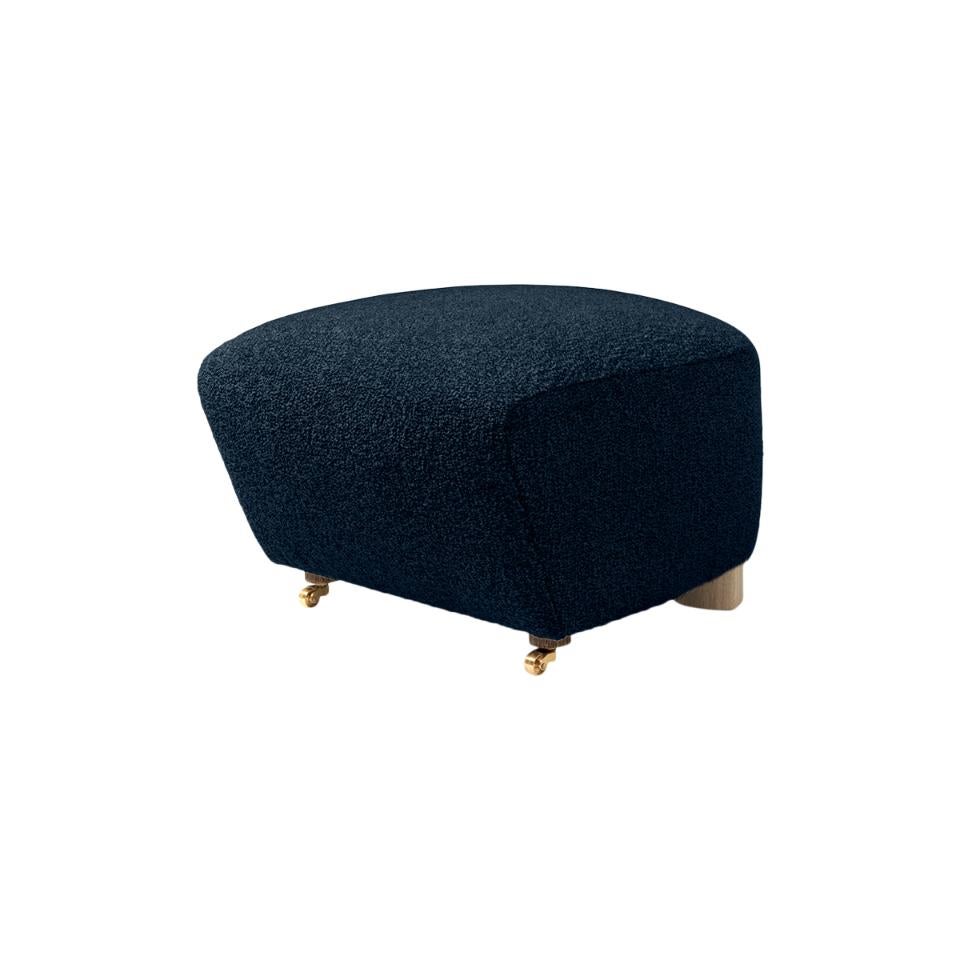 Blue natural oak sahco zero the tired man footstool by Lassen.
Dimensions: W 55 x D 53 x H 36 cm. 
Materials: Textile

Flemming Lassen designed the overstuffed easy chair, The Tired Man, for The Copenhagen Cabinetmakers’ Guild Competition in