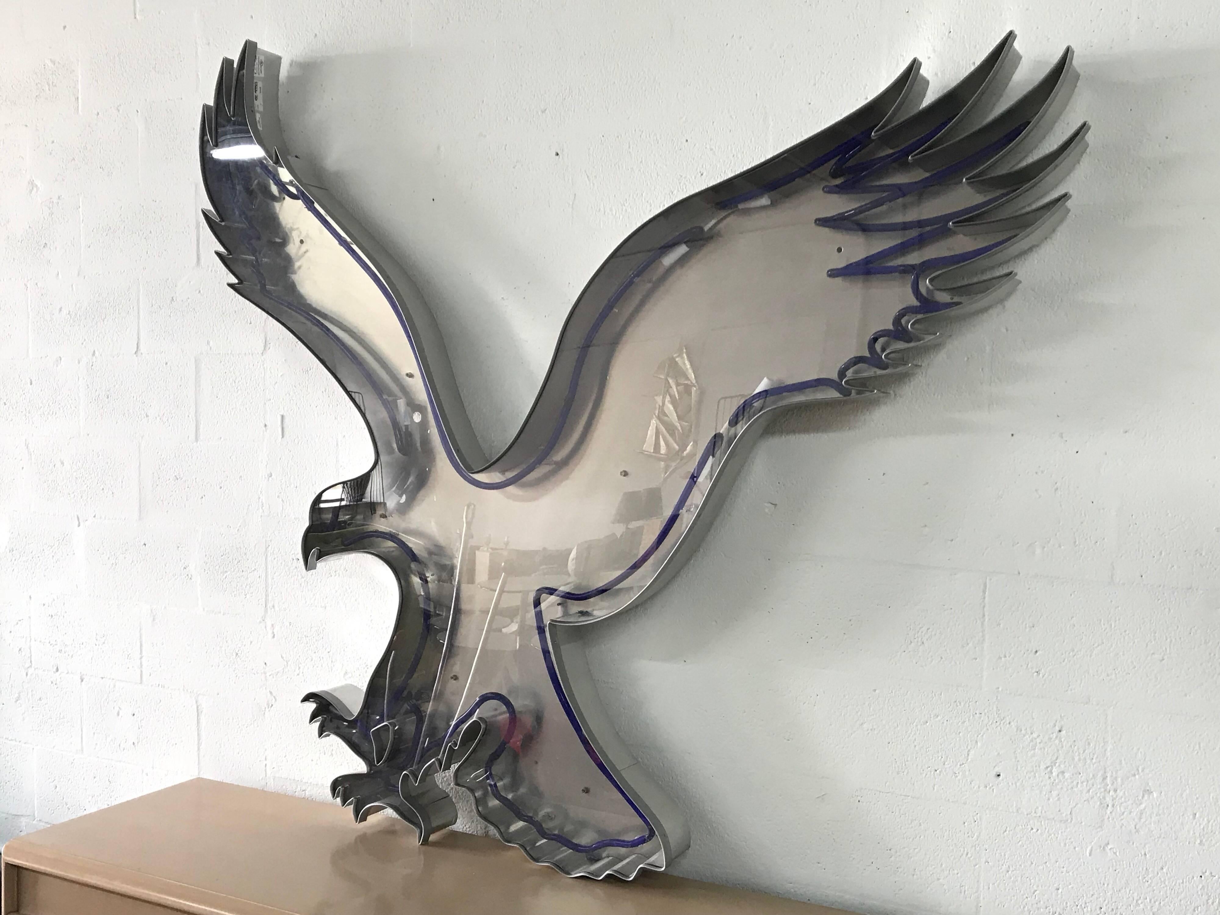 Folk Art neon sign of an eagle rendered in blue neon incased in an aluminum frame with a Lucite cover.