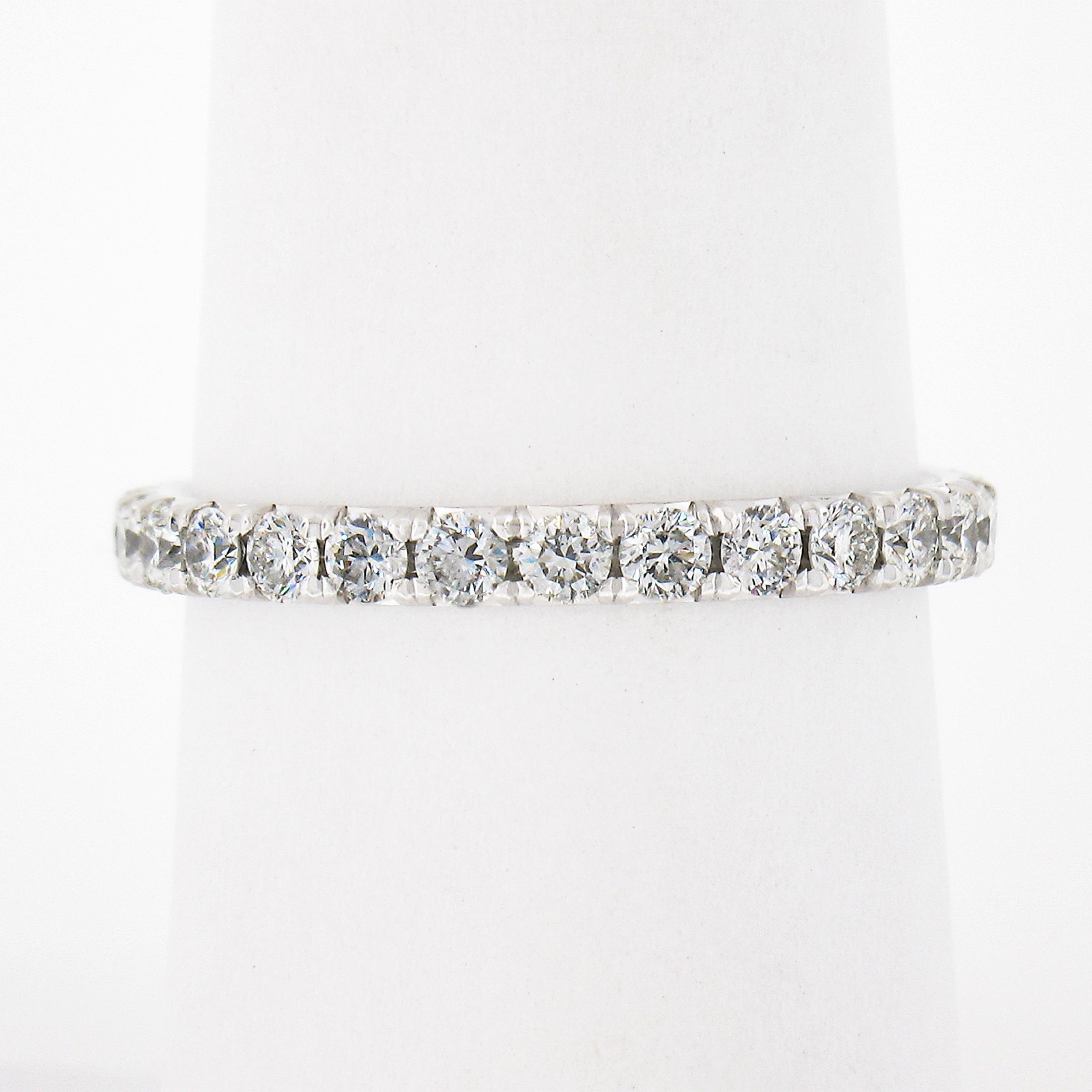 This Blue Nile eternity band ring was crafted from solid .950 platinum and features 27 round brilliant cut diamonds neatly French pave set entirely around band. This well made eternity band ring has a thin and delicate look on the finger and would
