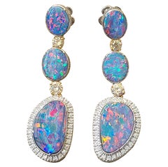 Blue Opal and Yellow Diamond Earrings Set in 18 Karat Gold