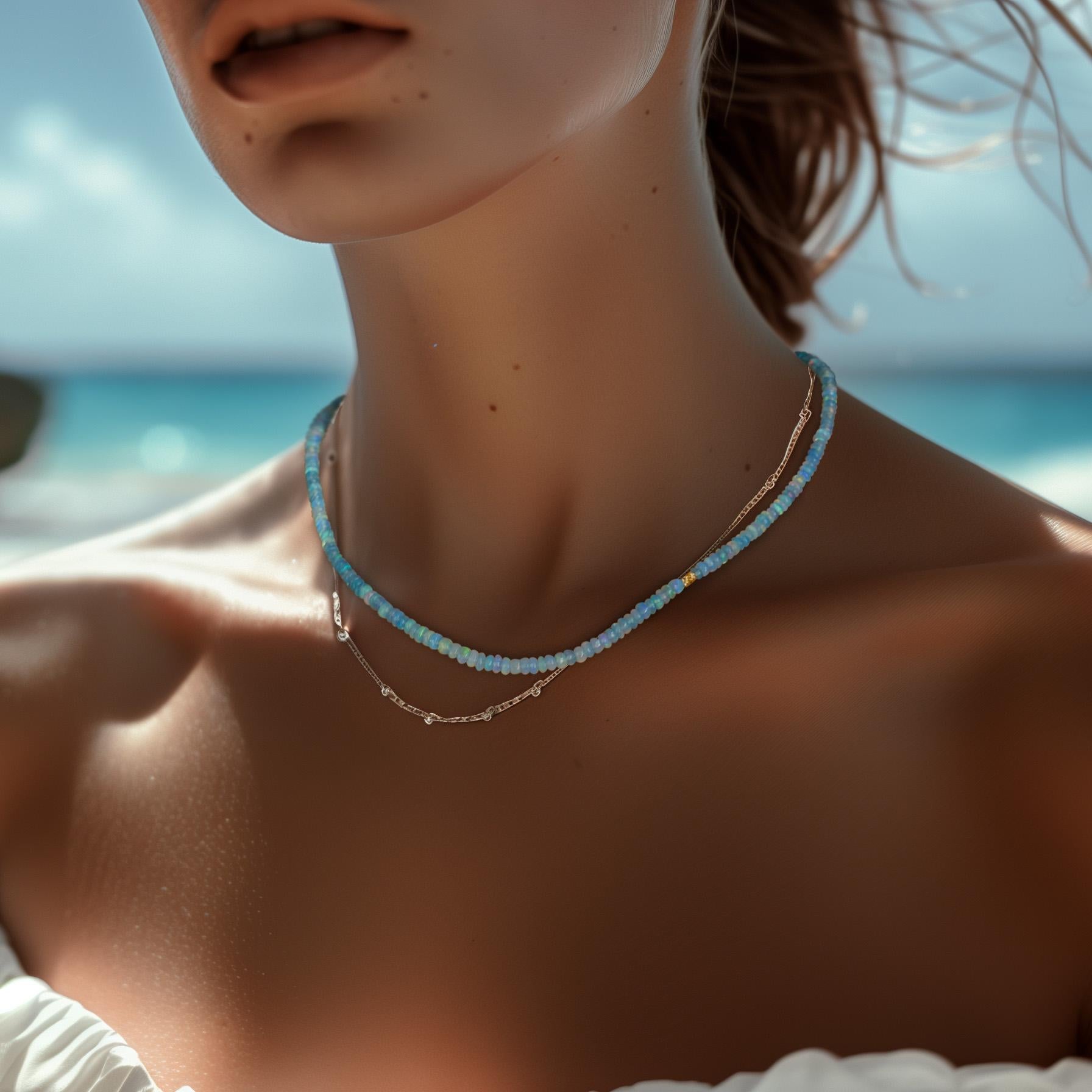 This blue opal necklace from Bombyx House features a delicate, shimmering strand of vibrant blue gemstones. The opulent opal hues evoke a sense of serene tranquility, making this piece a sophisticated accessory to complement any look.

	•	16