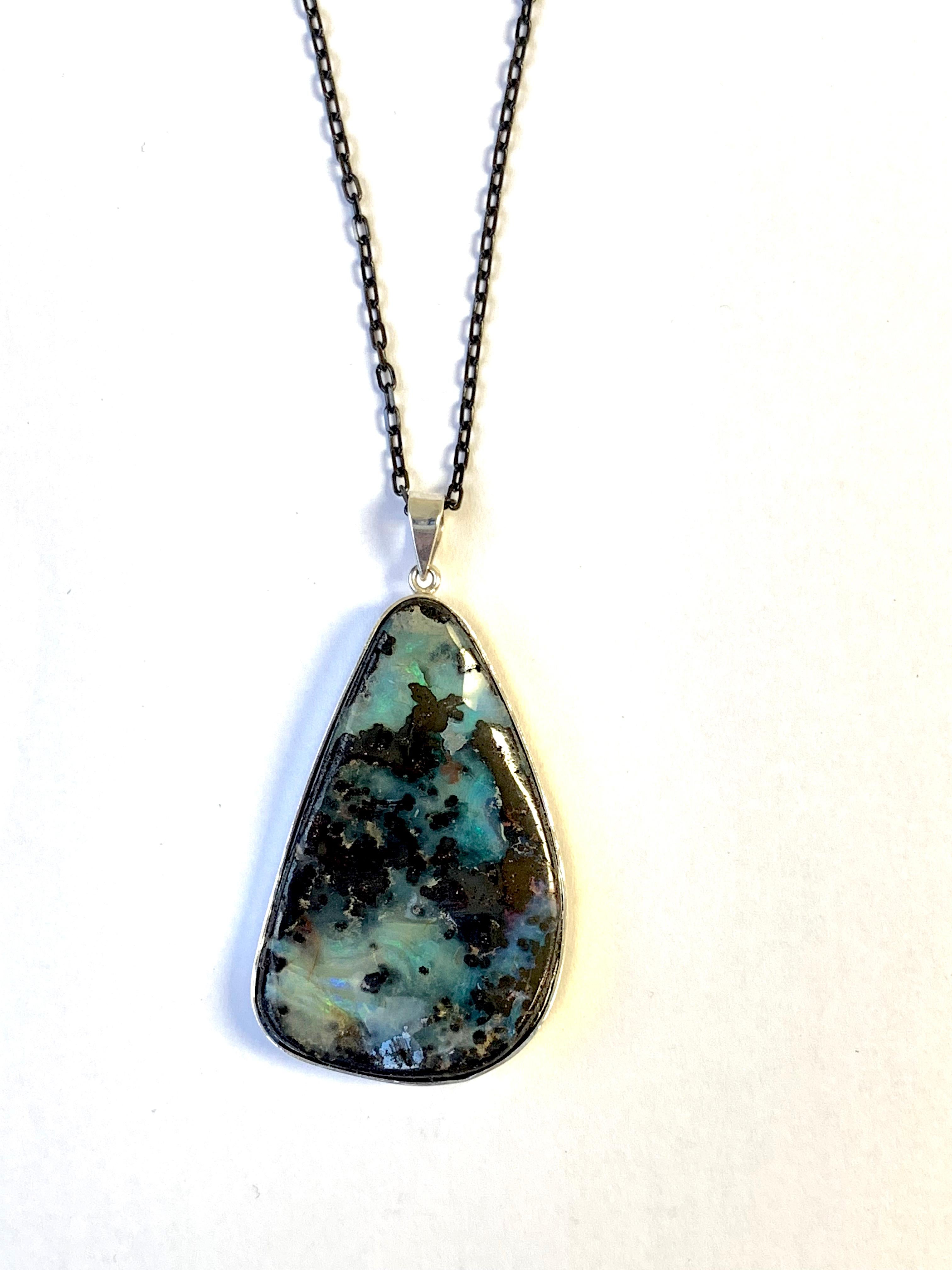 A unique piece, this Opal is a true showstopper! 

Material: Silver
Center Stone Details: 1 Opal at 40 x 28mm
Chain:  16 inch

Fine one-of-a-kind craftsmanship meets incredible quality in this breathtaking piece of jewelry.
