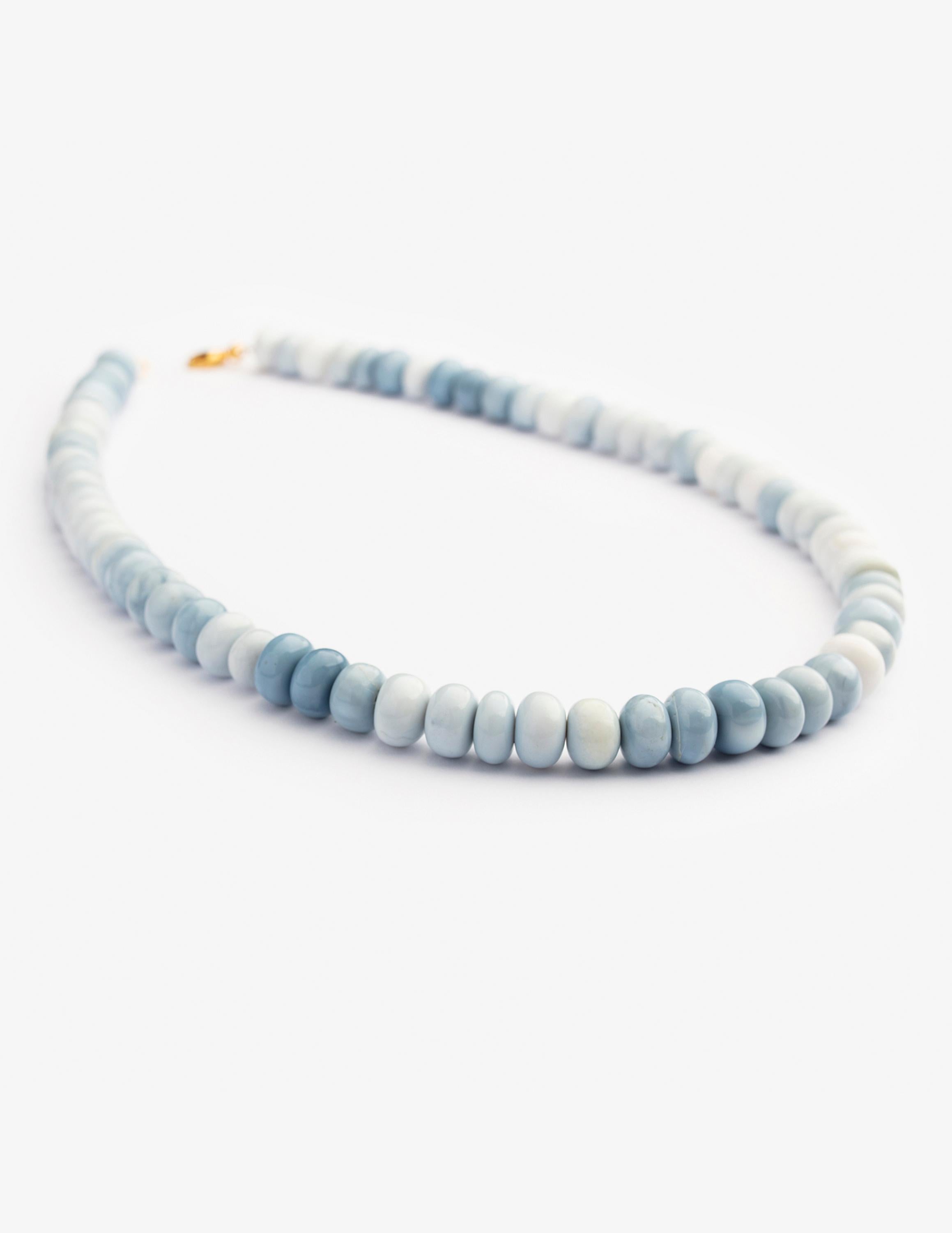 This elegant Blue Opal Necklace crafted out of very high quality.
The stones which in this necklace are in rondelle cut. This necklace is very striking on its own and complements your combinations. This necklace provides fashionable, luxury  and