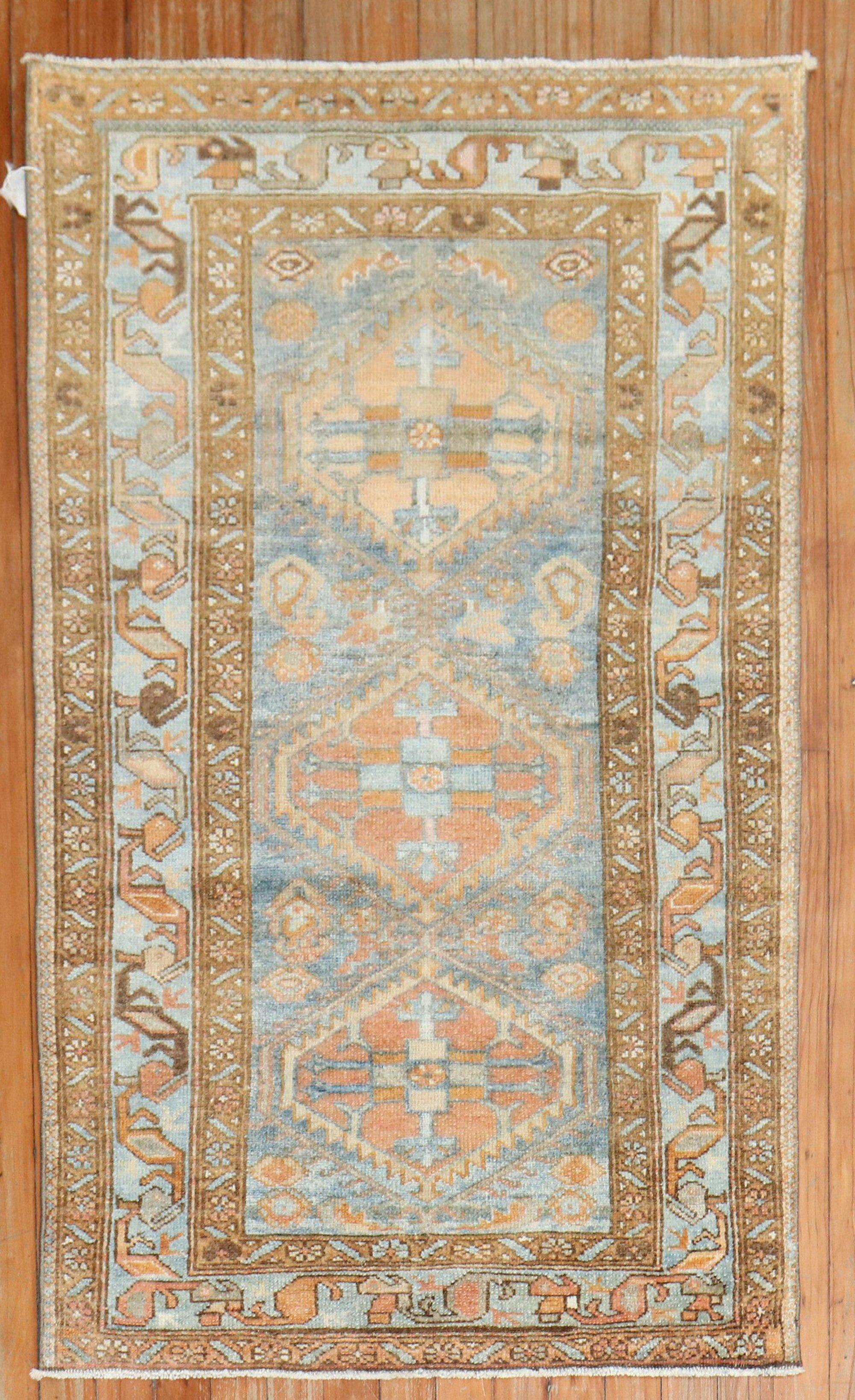 A small size early 20th century Persian Malayer rug in blue and orange

Measures: 2'7