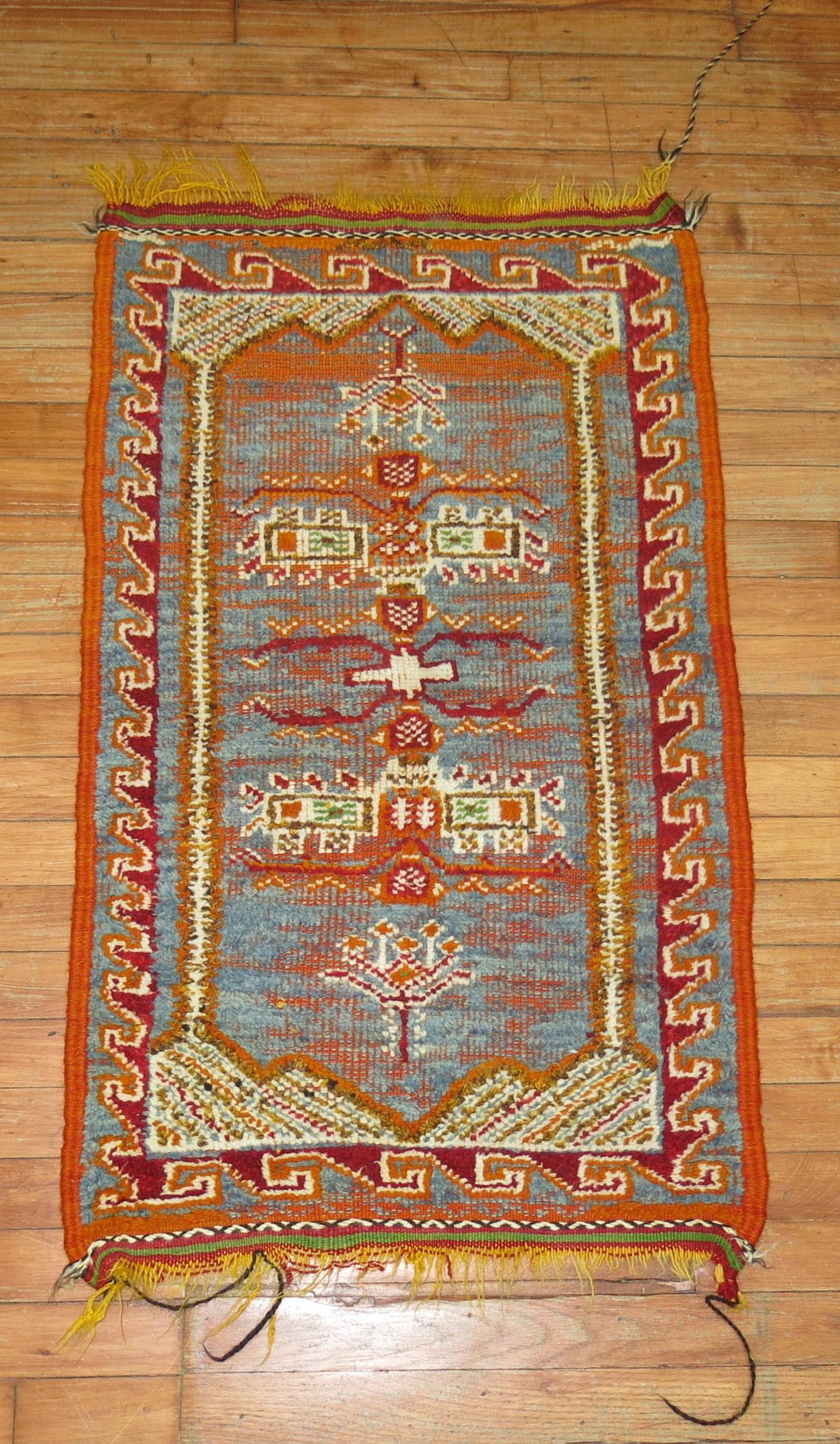 Odd size one of a kind blue and orange vintage Moroccan mini size rug

Measures: 2' x 3'4''.
