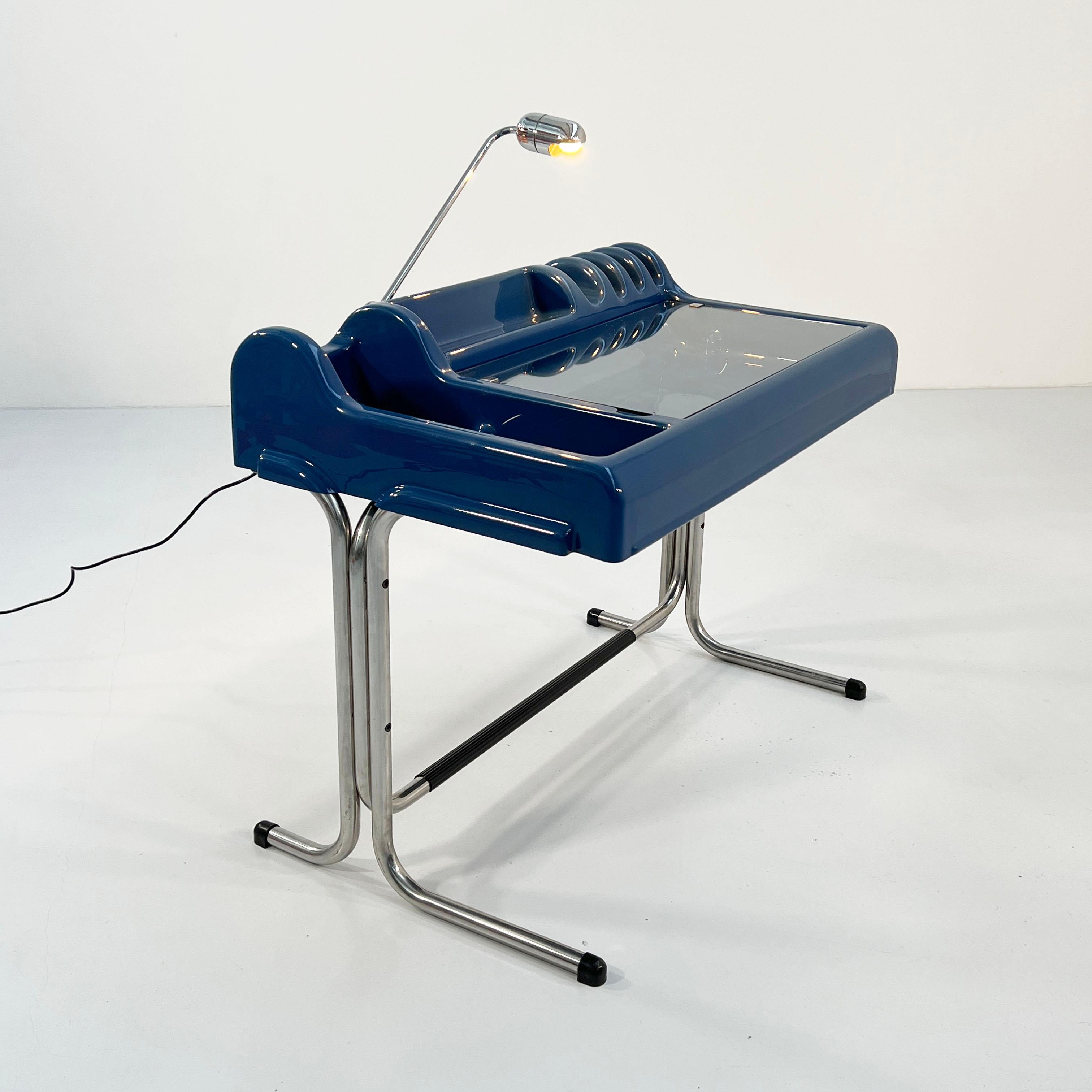 Designer- Vittorio Parigi & Nani Prina
Producer- Molteni
Model- Orix Desk 
Design Period- Seventies
Measurements- Width 100 cm x Depth 63 cm x Height 82 cm
Materials- Plastic, Steel
Color- Blue, Silver
Light wear consistent with age and use.