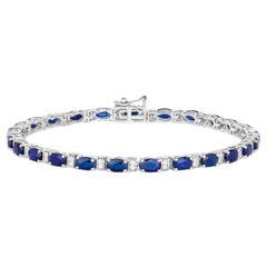 Pulsera de zafiros azules talla oval eslabones de diamantes 5,75 quilates oro blanco de 14 quilates