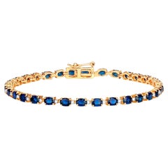 Blaues Armband mit blauen Saphiren im Ovalschliff und Diamantgliedern 6.3 Karat 10K Gelbgold