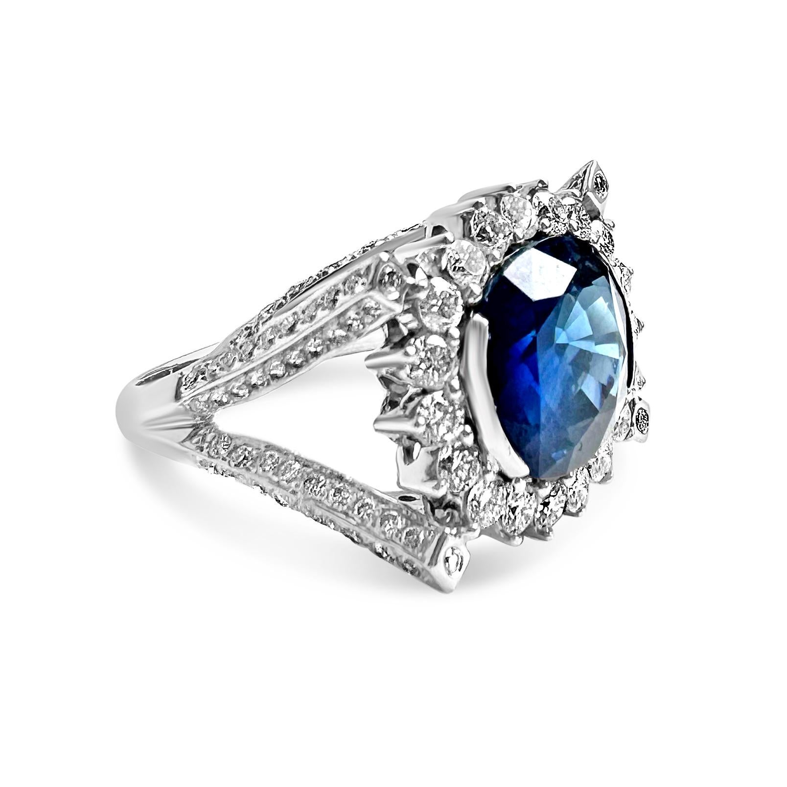 Modern Blue Oval Sapphire (6.15cts) & Diamond 18K White Gold Cocktail Ring by Manart For Sale