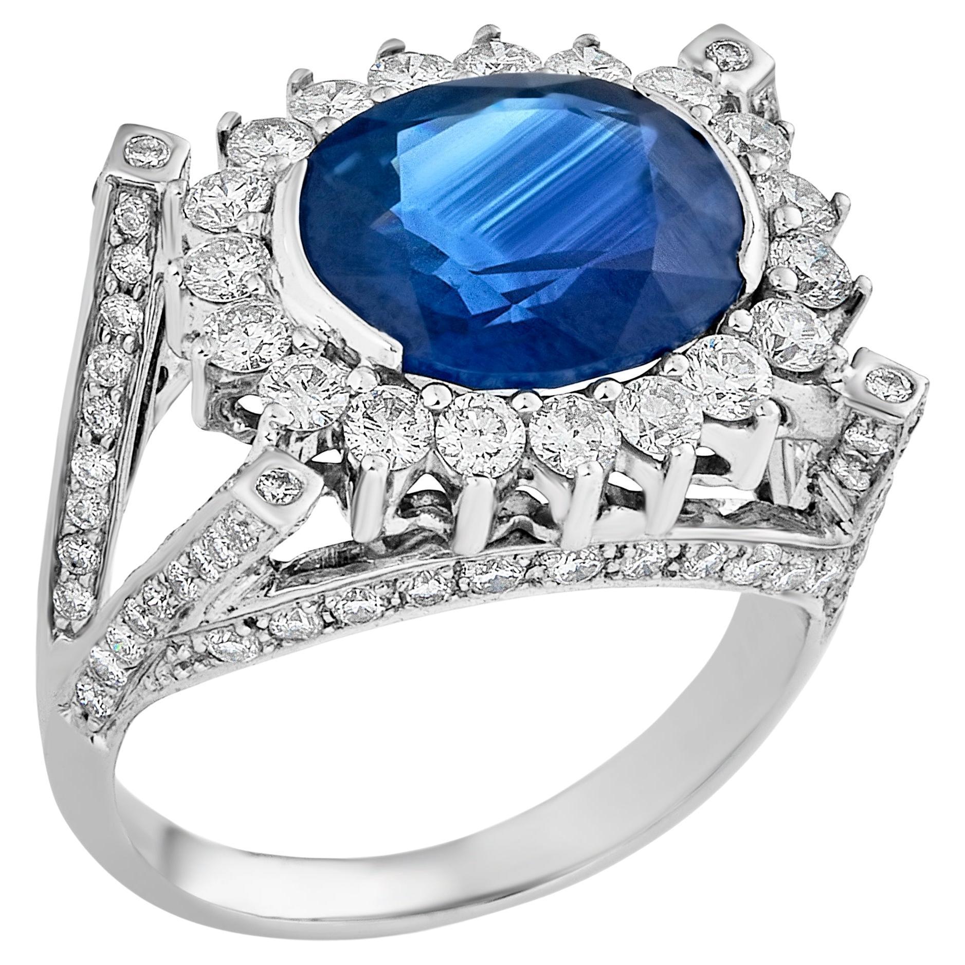 Blue Oval Sapphire (6.15cts) & Diamond 18K White Gold Cocktail Ring by Manart For Sale