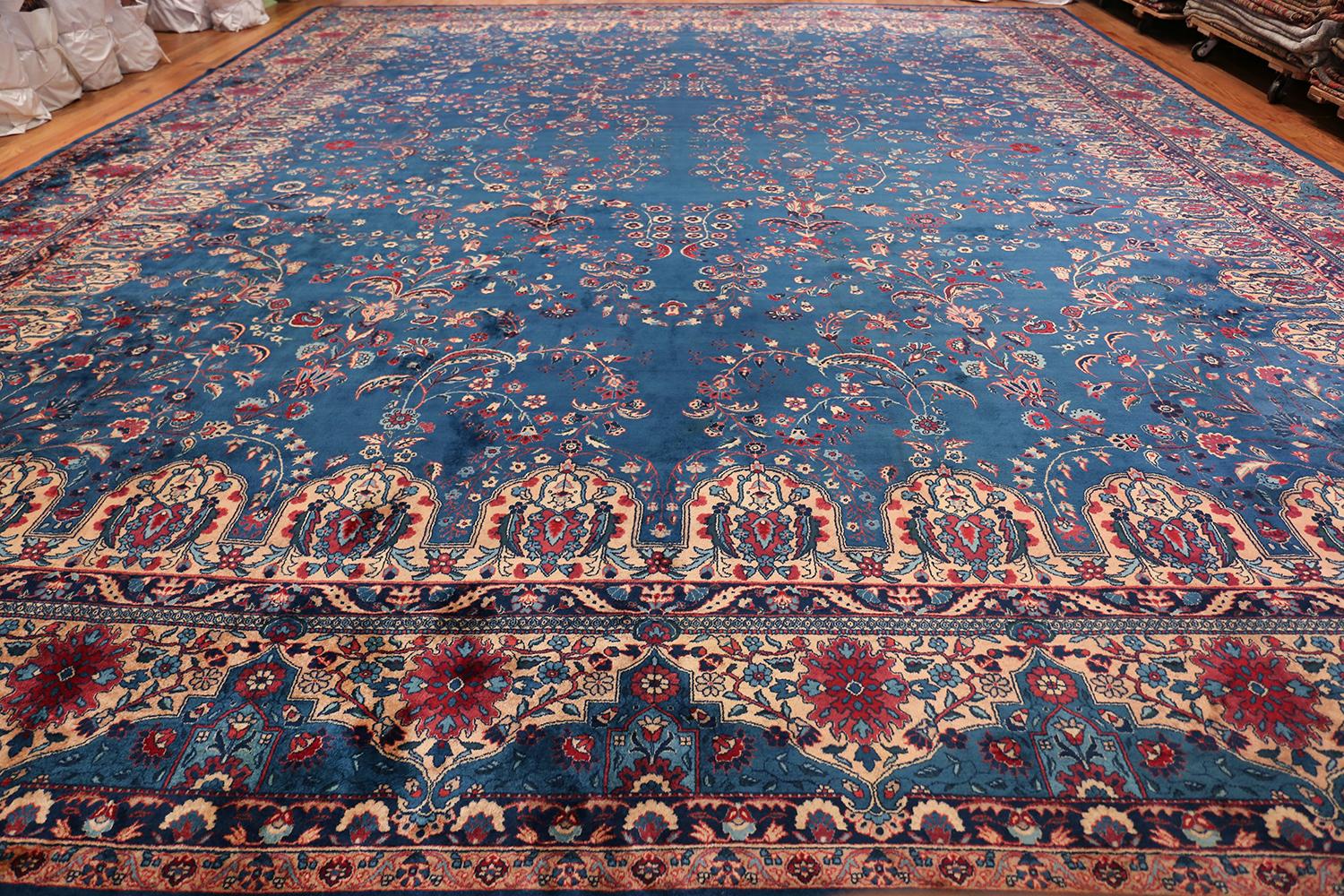 Breathtaking blue oversize floral antique Indian rug, country of origin / rug type: India, date: circa 1920. Size: 17 ft x 20 ft 10 in (5.18 m x 6.35 m)

Vibrant blues and stunning reds create the impression of a formal reflecting pool in this