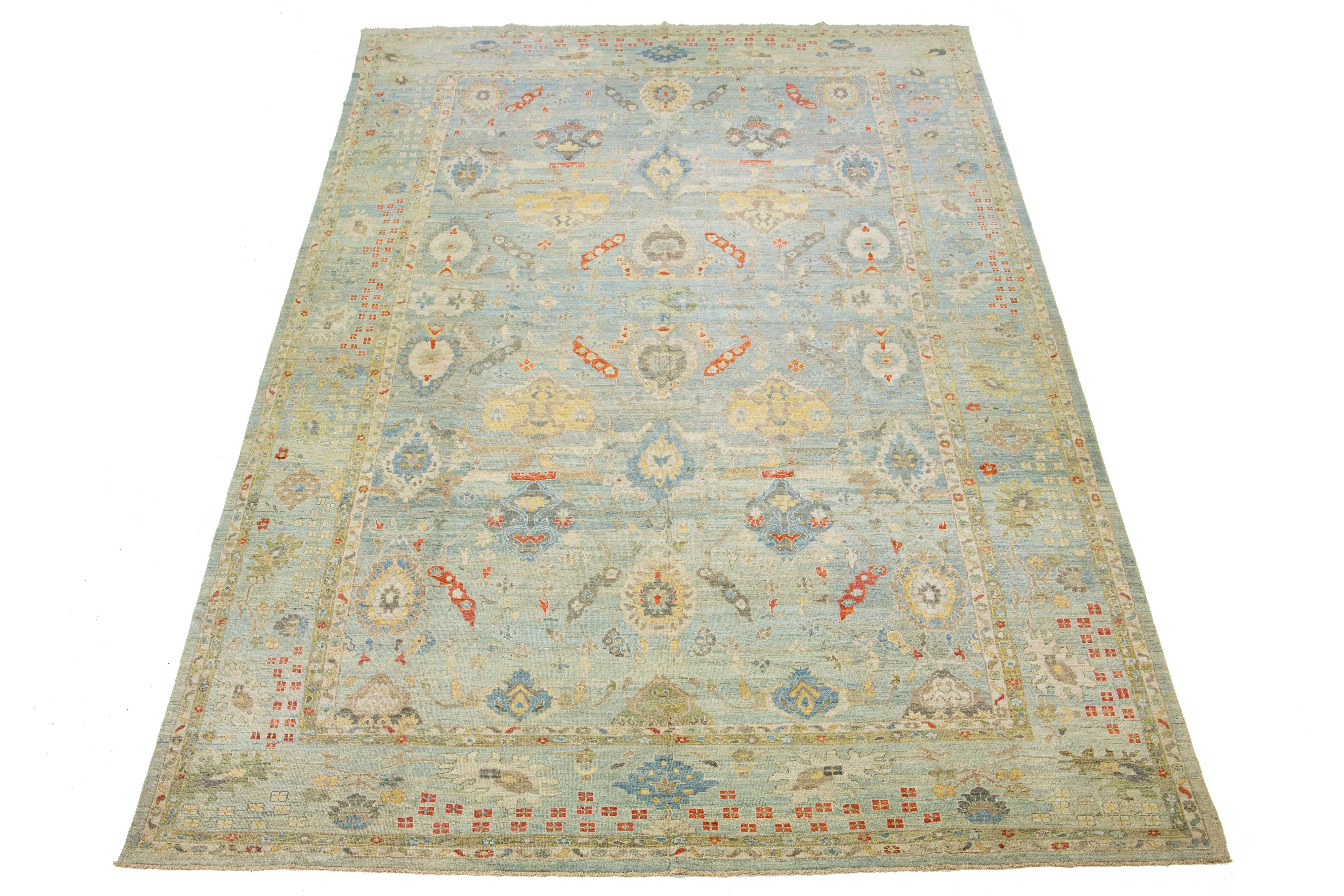 Beautiful modern Sultanabad hand-knotted wool rug with a blue field. This Sultanabad rug has a designed frame and multicolor accents in a gorgeous classic floral pattern.

This rug measures 13' x 21'.

