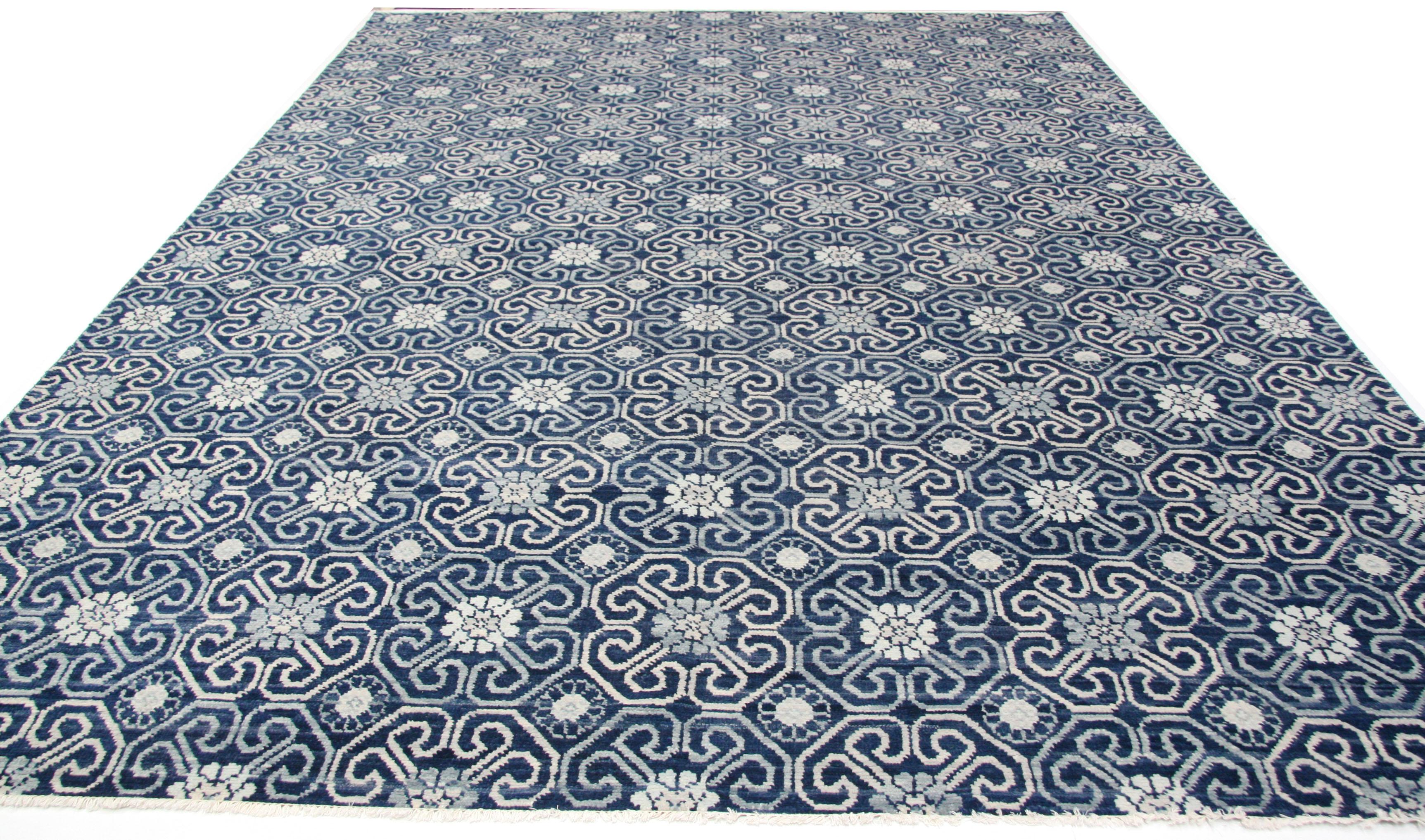 Geometric floral all-over pattern rug. Hand knotted wool, made in India using natural vegetal dyes. A charming contemporary rug for the modern home or office. Measure: 10 x 14.