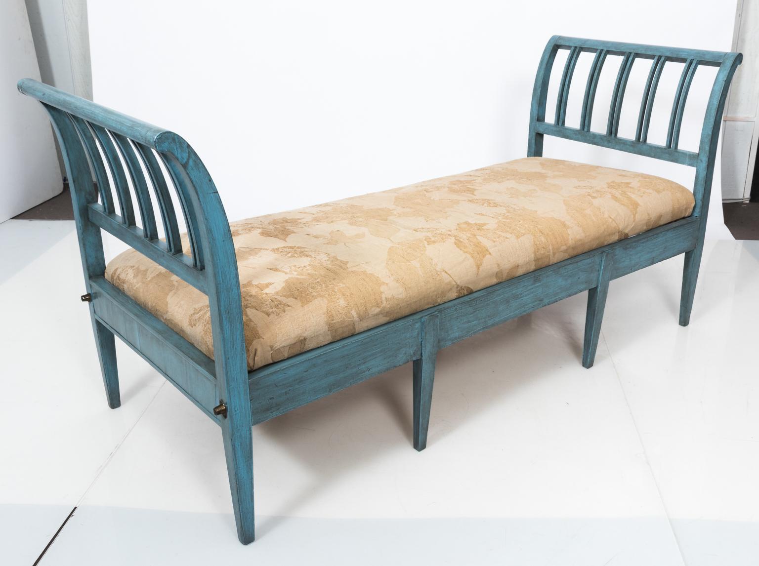 Blue painted Federal style daybed with cream upholstery, circa 20th century. The paint is in a distressed finish. Please note of a crack on the corner of one top rail.
 