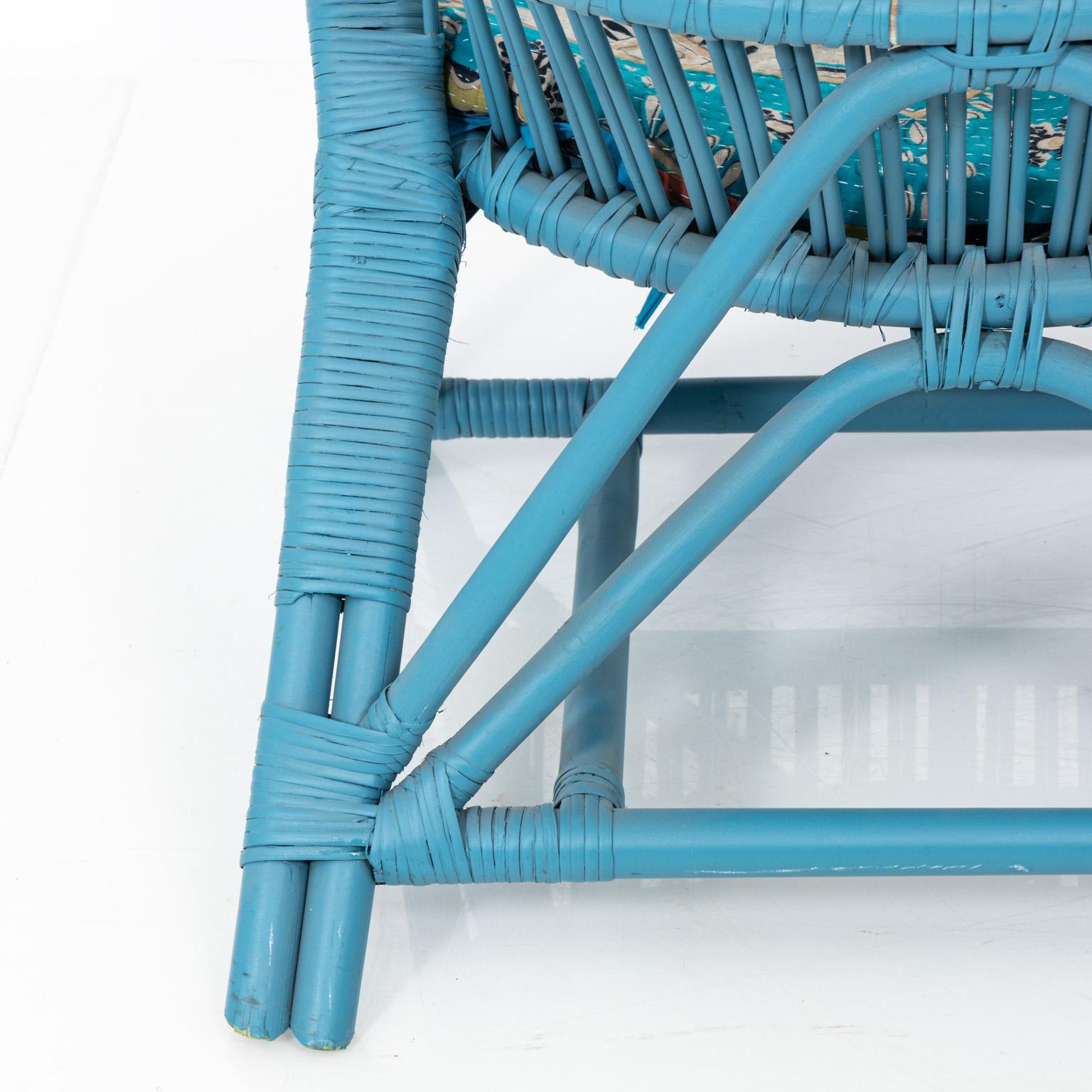 Blue painted rattan low chair with upholstered seat, circa 20th century.