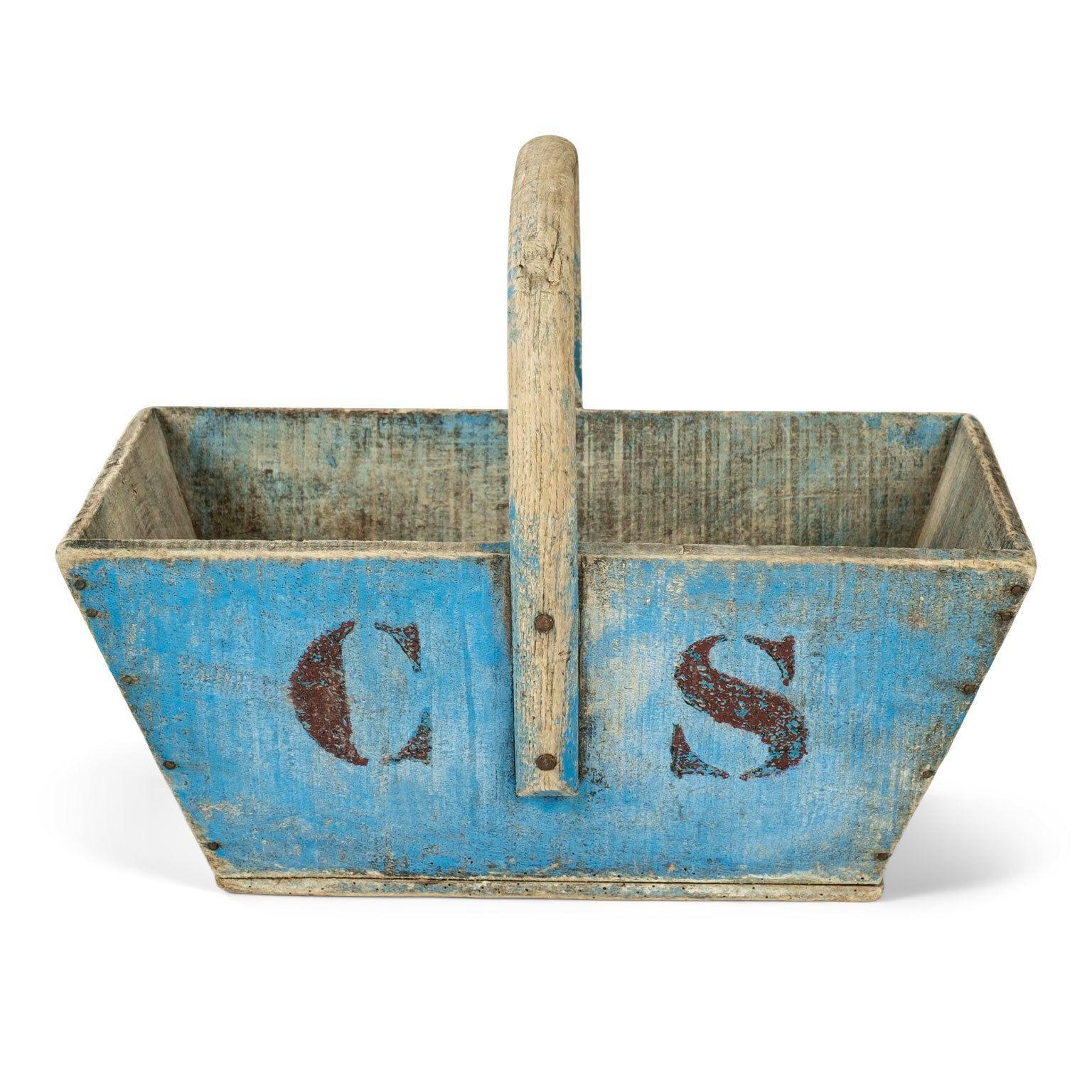 Blue-painted wooden Swedish basket, or caddy, circa 1880-1910. Bentwood handle, rectangular tapered shape and sturdy nail construction. Losses to original - or early - blue painted finish. Initialed 