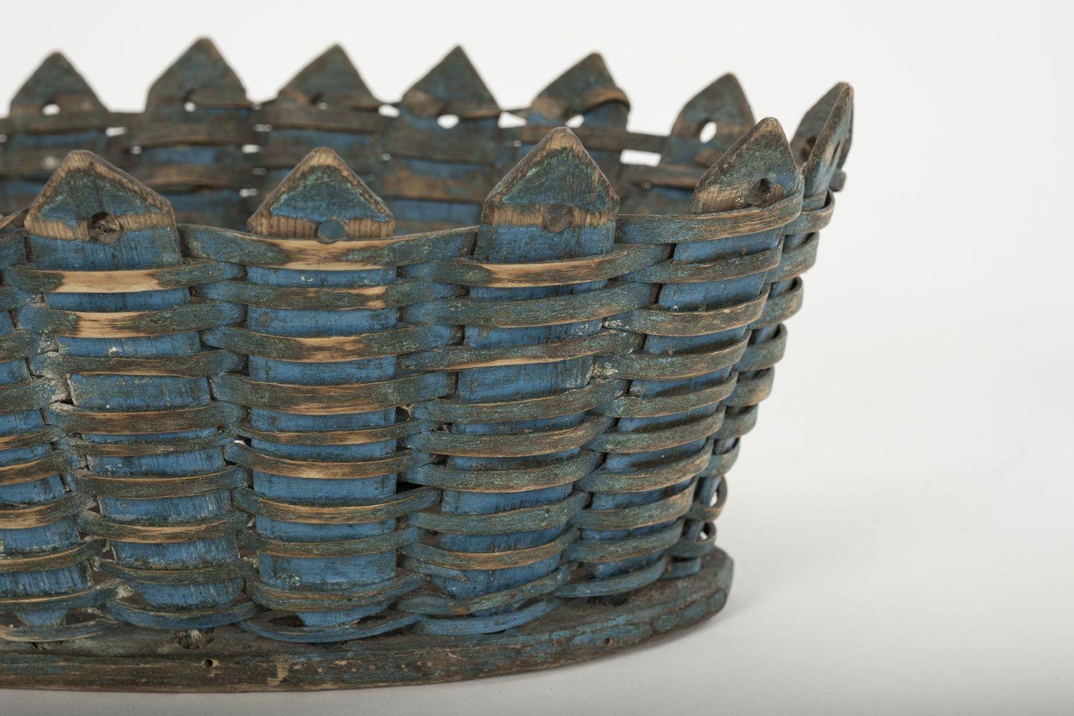 Blue-painted woven wood Swedish basket, dating to late 19th century.