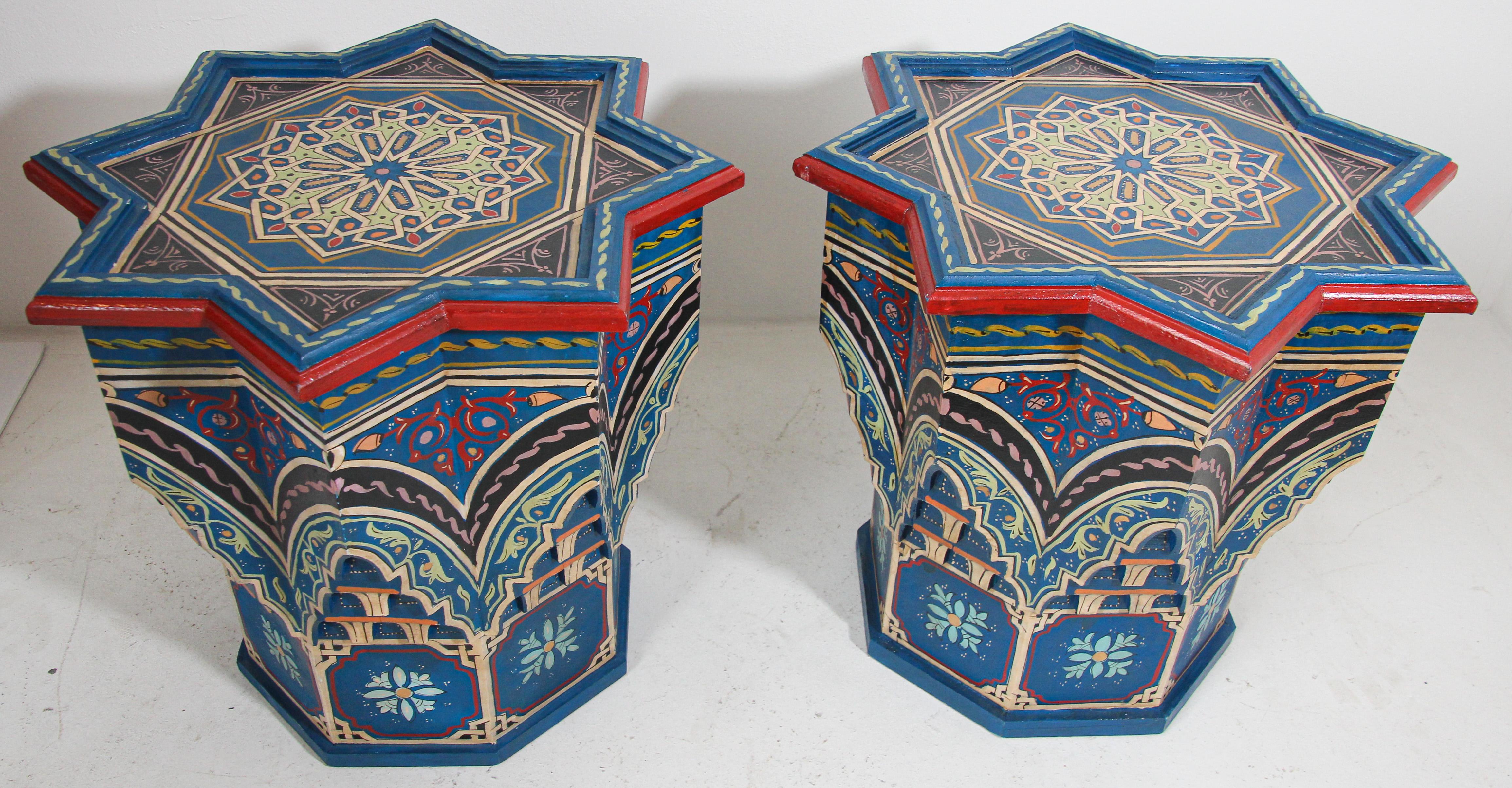 Pair of Moroccan colorful blue hand painted and carved side occasional table with Moorish Islamic designs.
Vintage 1970s Moroccan hand-painted blue wooden end tables with floral and geometric designs in traditional Mediterranean colors, carved with