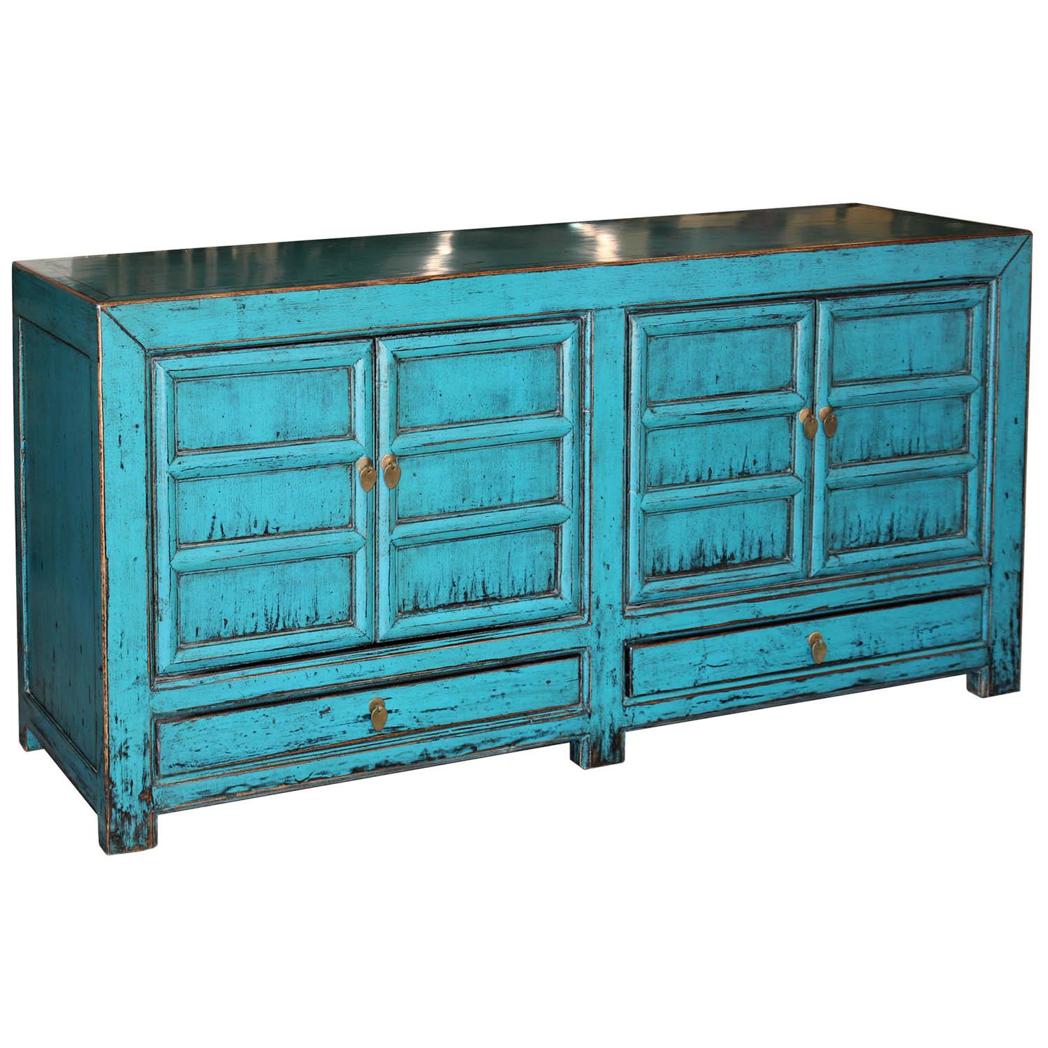 Contemporary blue lacquer buffet with two bottom doors, exposed wood edges and will brighten up any room in the house. Use in the entry, living or dining room for a pop of color.