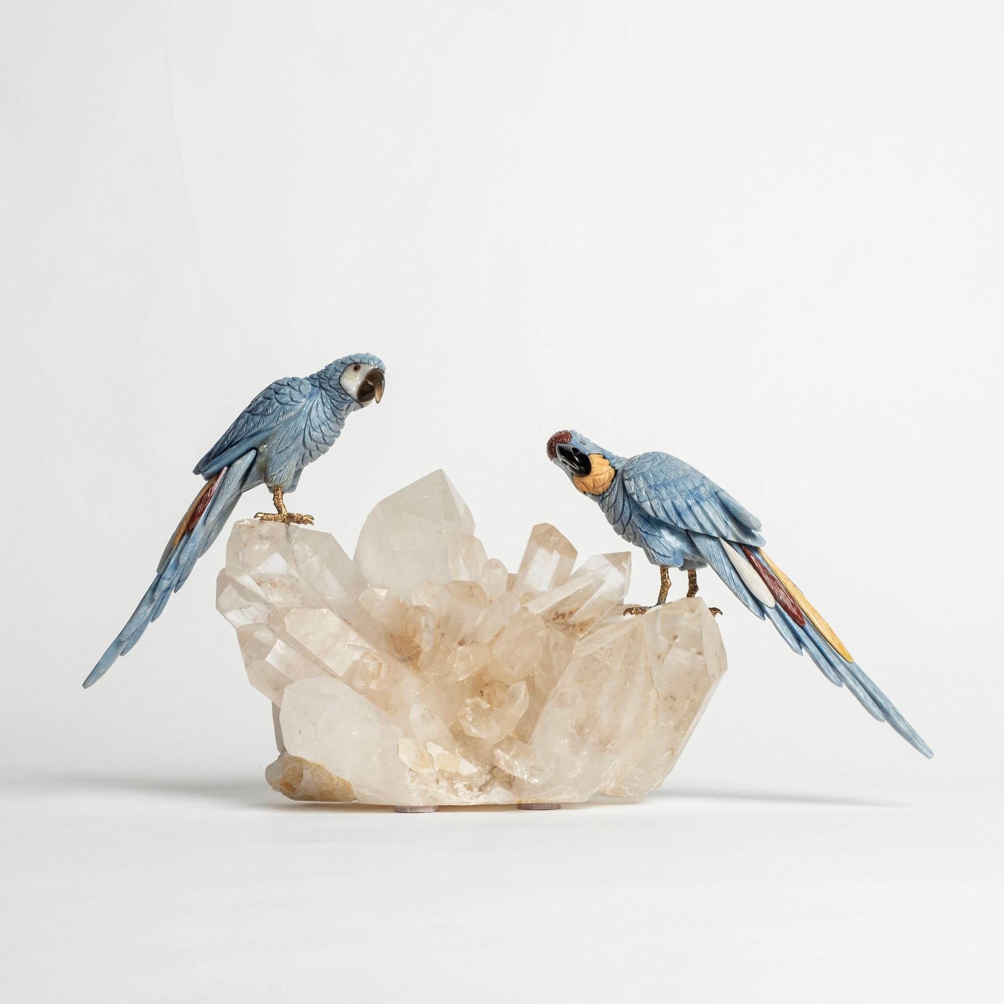 21st Century Brazilian hand-carved parrots from semi-precious stones (sodalite, yellow & red jasper, obsidian) on a large natural quartz specimen base. 