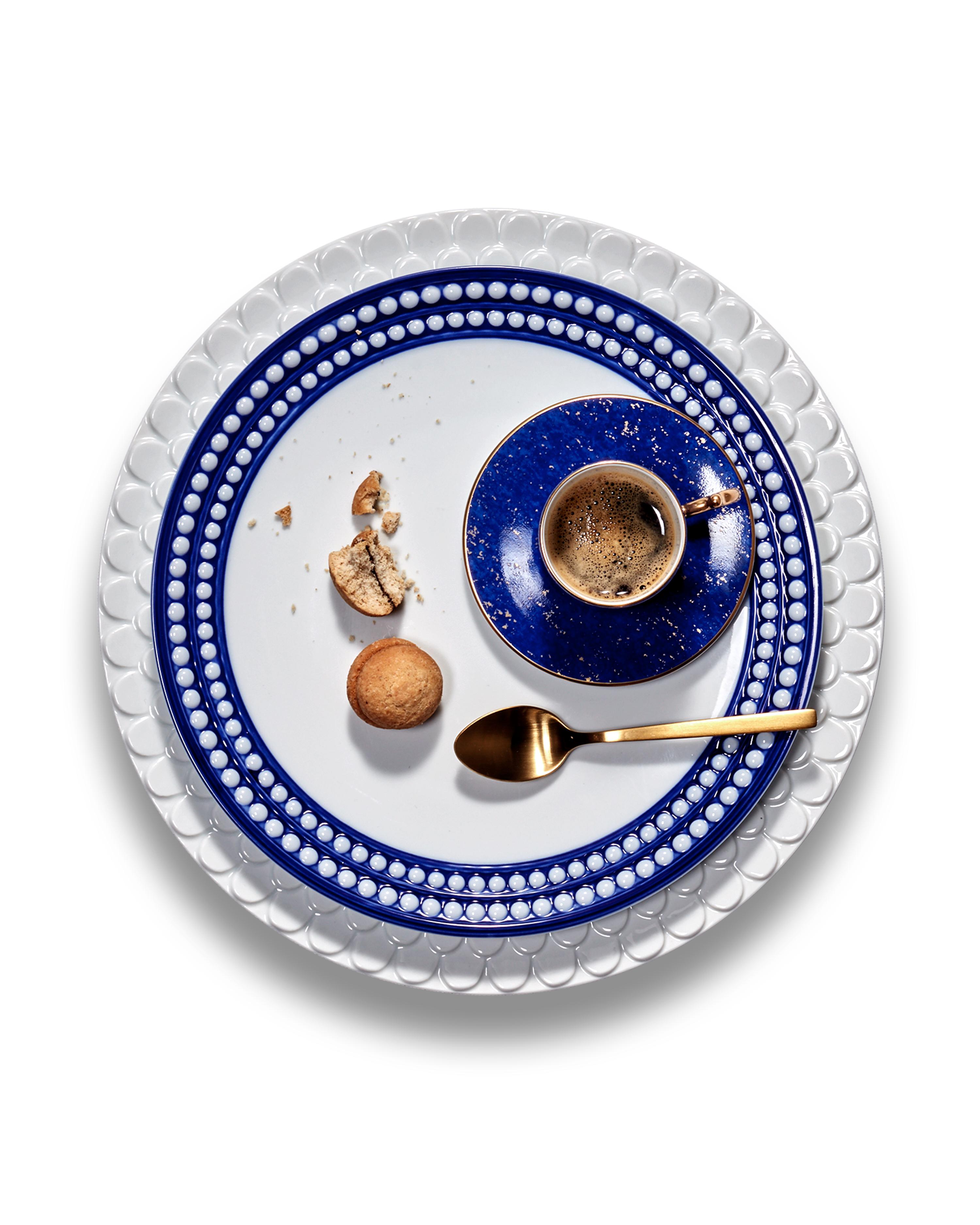 Inspired by the enduring modernity and timeless elegance of the pearl, Perlée is an expression of classic dinnerware. Hand-crafted from fine white porcelain with meticulously hand-painted details available in brilliant cobalt blue

The Perlee
