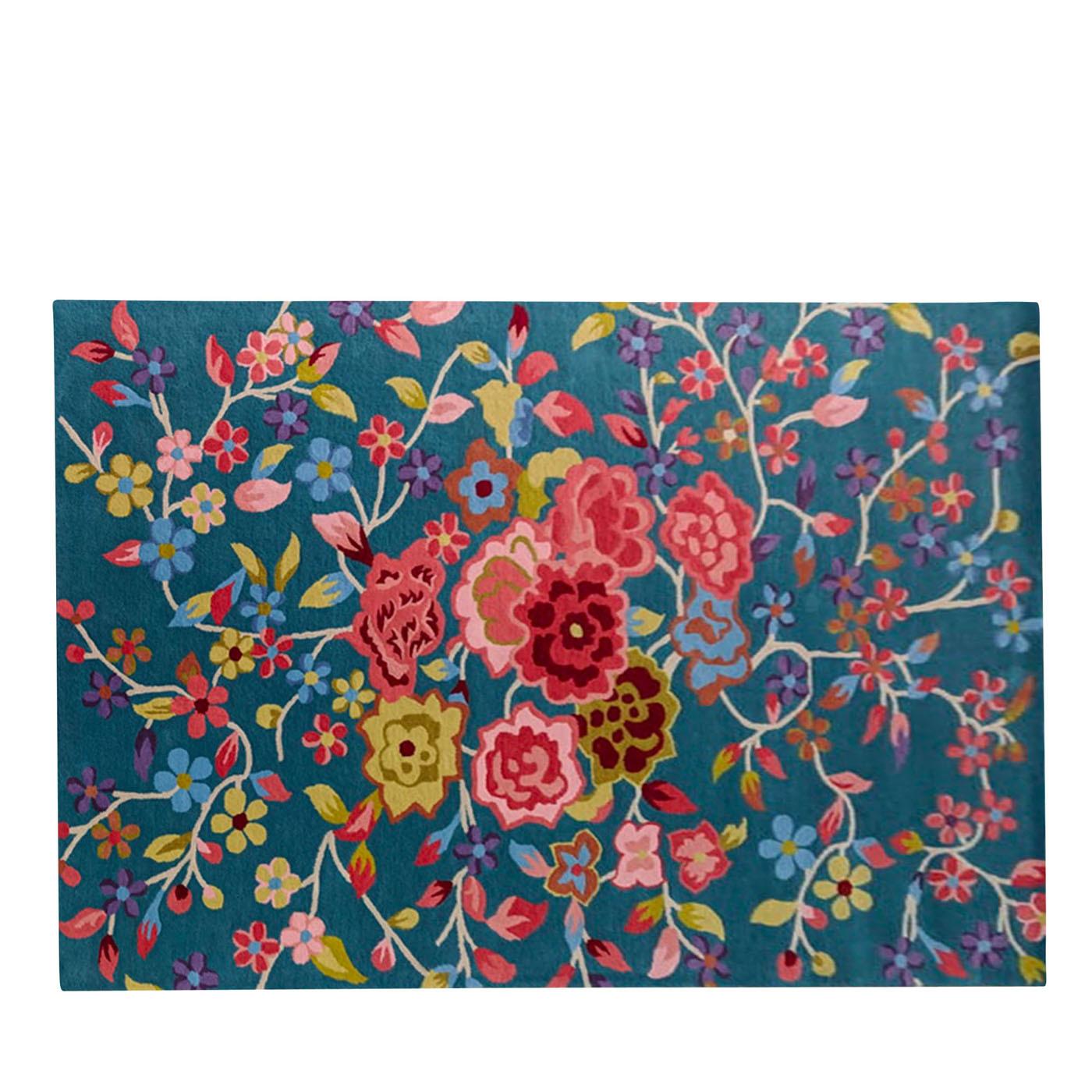A harmonious palette of vibrant colors outlines this sumptuous, Persian-inspired carpet that pays homage to the Qadjar dynasty. Dominated by a vibrant color palette, this rug is defined by a dynamic arrangement of springtime flowers: a central