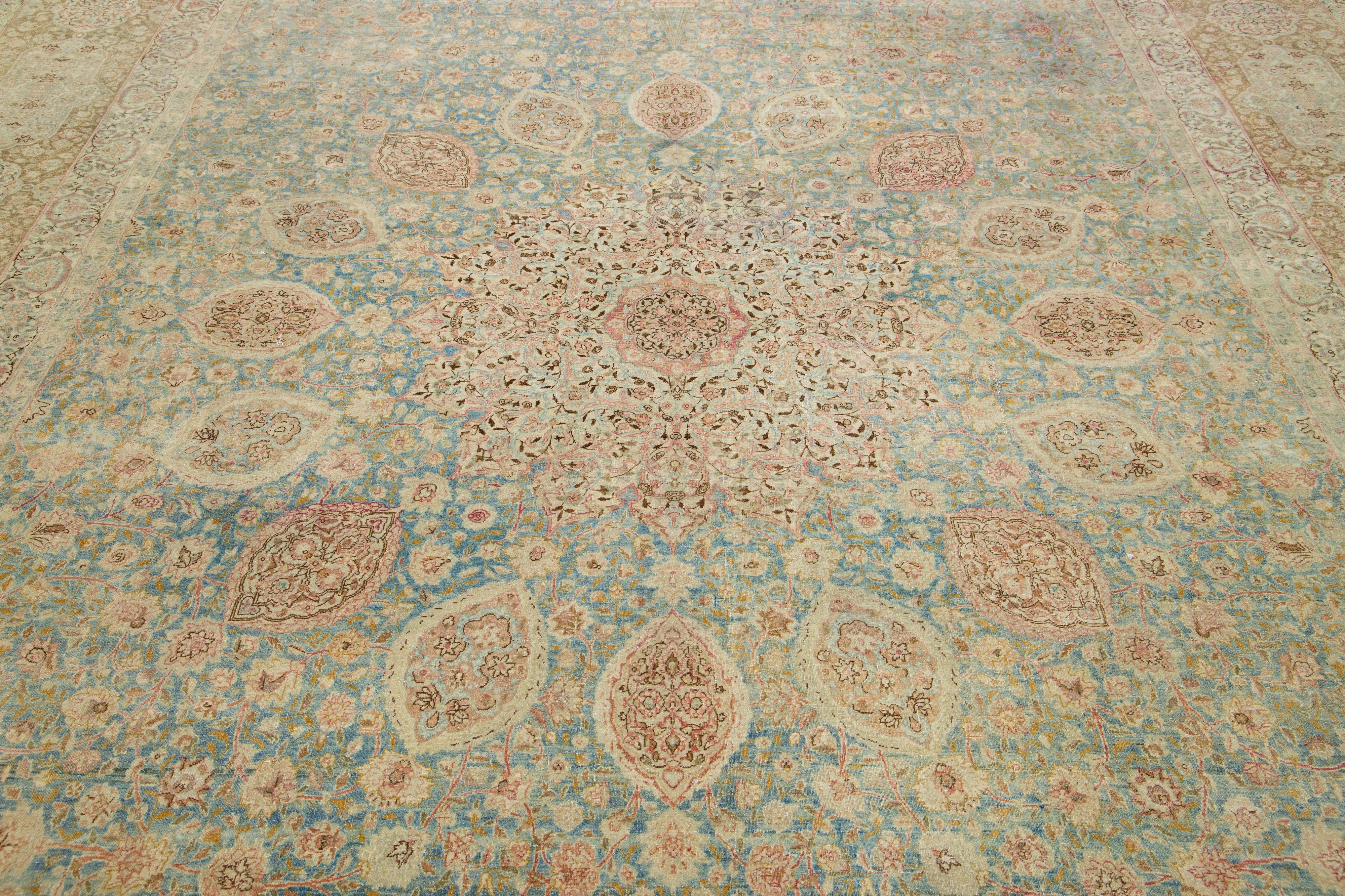 20th Century Blue Persian Antique Kerman Handmade Wool Rug With Rosette Design For Sale