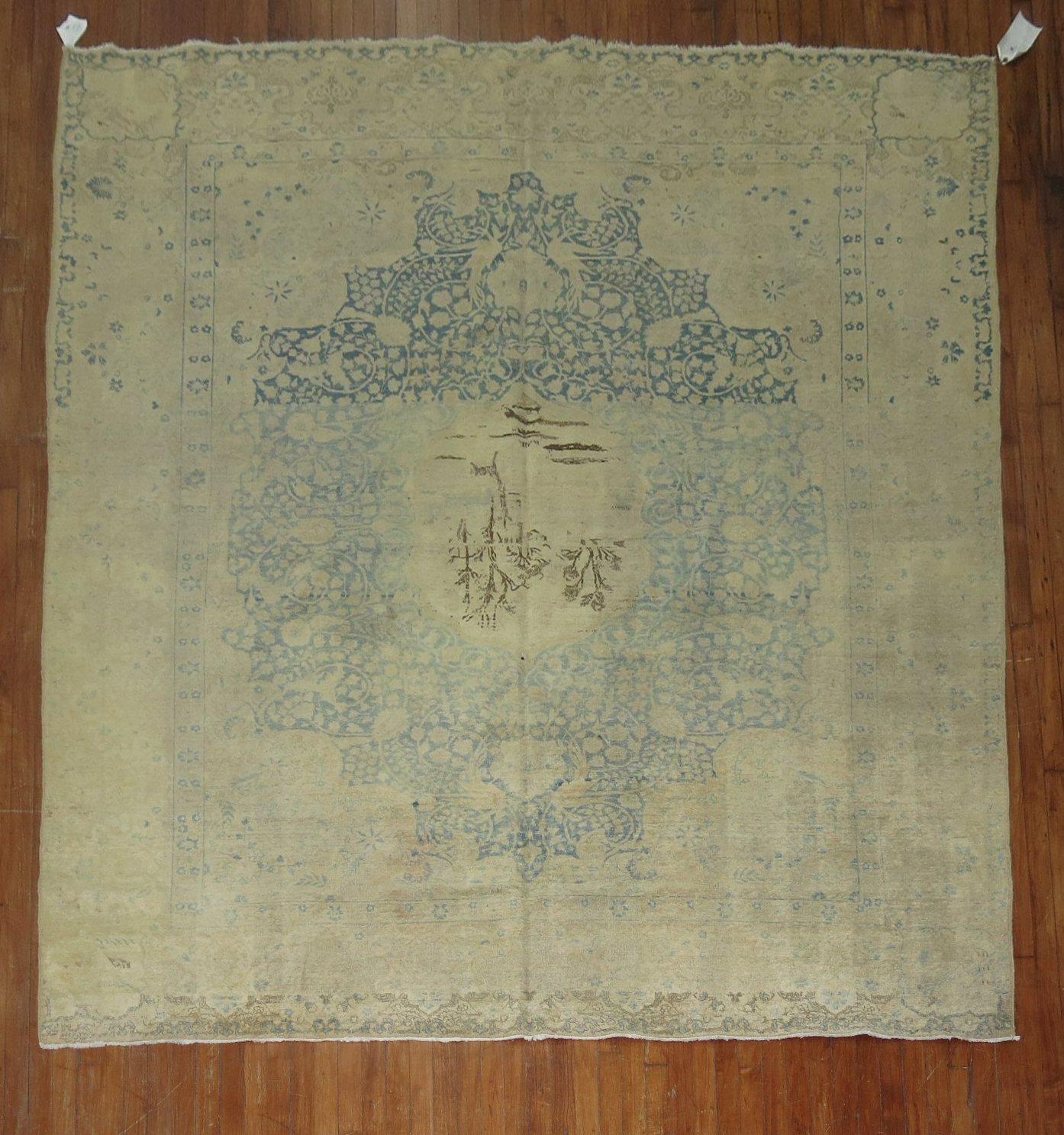 A 20th-century room size Persian Kerman rug in beige, light blue, green brown, and beige

Measures: 8'3'' x 9'10''.