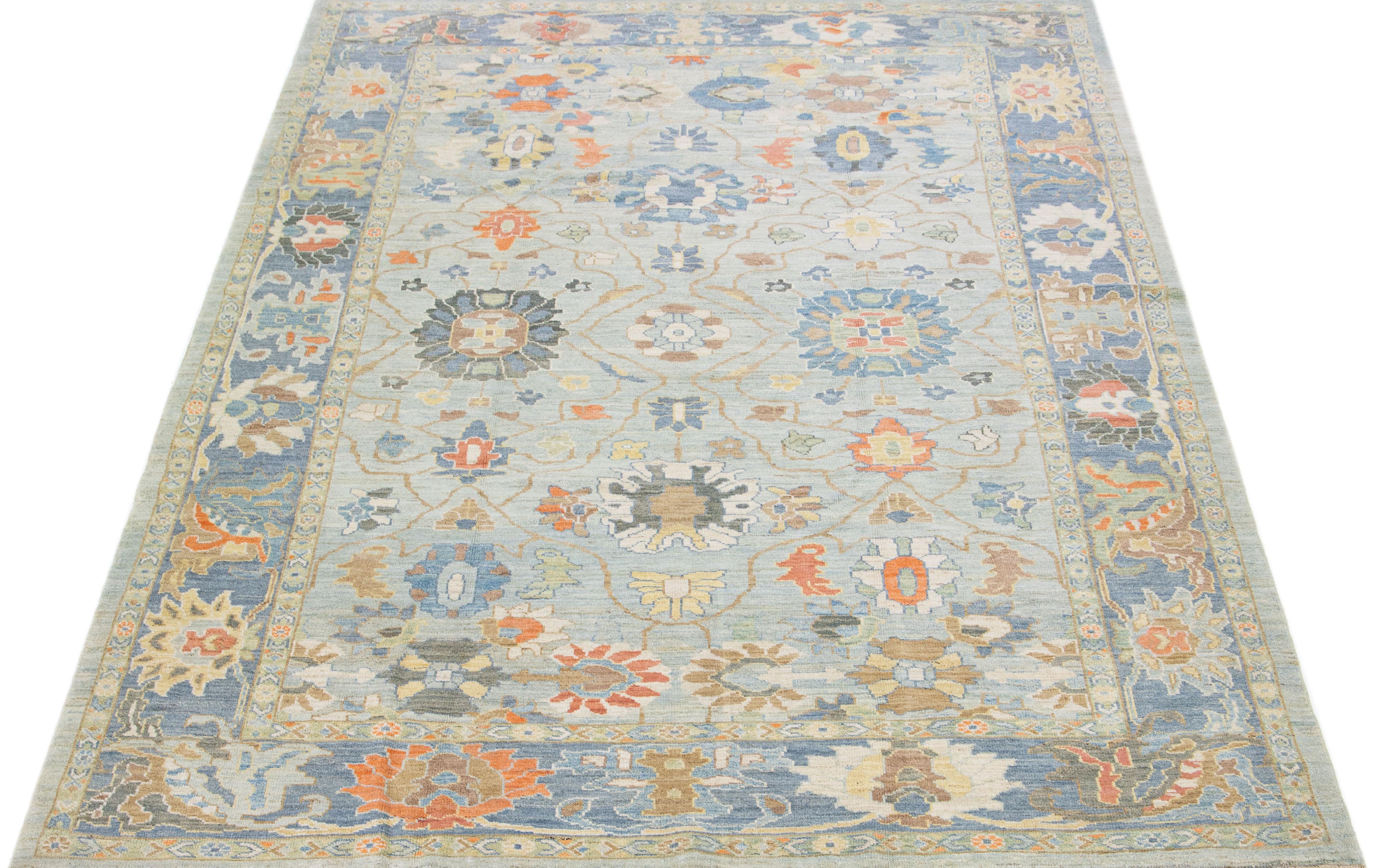 Beautiful modern Sultanabad hand knotted wool rug with a light blue color field. This rug has a designed frame with multicolor accents in a gorgeous all-over floral design.

This rug measures: 8'8